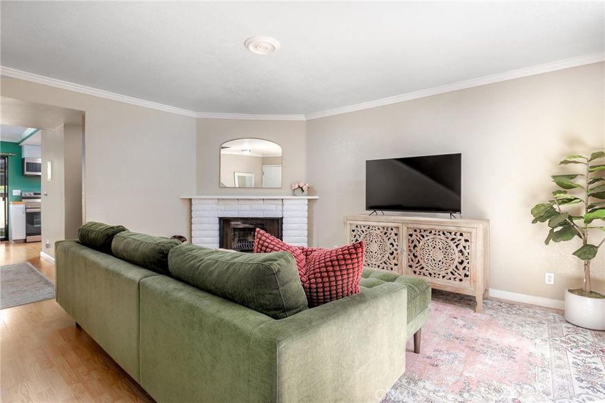 Experience the charm of San Luis Obispo living in this beautifully updated condo, nestled in the quaint Ridgepoint complex.  As an end unit with only one shared wall, it offers added privacy within a peaceful and well-maintained community.  Step into the welcoming living room, where a cozy fireplace sets the tone for chilly coastal and relaxing evenings. The kitchen was renovated in 2024 and features warm butcher block countertops, dimmable recessed lighting with a night light option, and the convenience of in-unit laundry.  There is a dining area off the kitchen and conveniently open to the private back patio.  Also downstairs, is a powder room thoughtfully updated with wallpaper, perfect for visiting guests.  Upstairs, you'll find two spacious bedrooms, including a tranquil primary bedroom.  Both bedrooms also boast private balconies—perfect for soaking in the Central Coast breeze or sunshine. Updated with tasteful paint tones and ceiling fans throughout, the home exudes an updated yet comfortable vibe.  Enjoy seamless indoor-outdoor living with front and rear patios ideal for entertaining or unwinding. The covered carport provides dedicated parking and extra storage space.  Ideally located near Cal Poly, downtown San Luis Obispo, beaches, and wine country, this home offers a lifestyle rich in sunshine, culture, and convenience. Embrace all that the Central Coast has to offer in this move-in-ready gem.