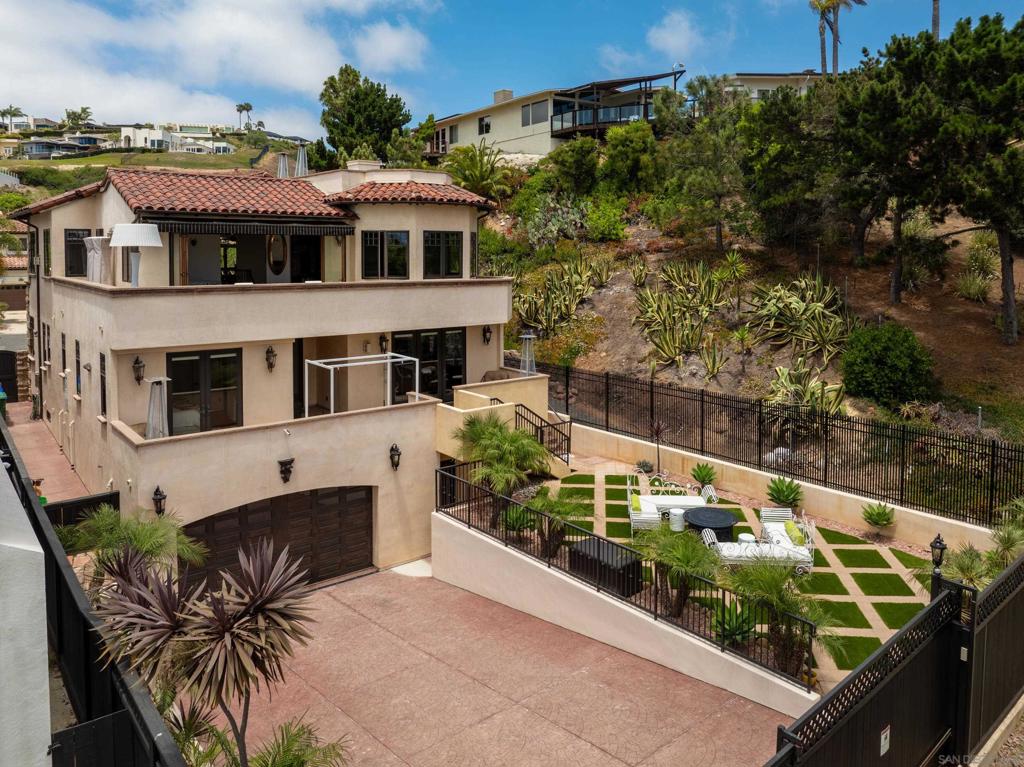 Welcome to this stunning single-family custom built home which offers impressive views of Downtown, Mission Bay, Mission Beach and the Coronado Islands which can be seen from the kitchen and living room. The rooftop terrace offers panoramic views! A subterranean, 2,200 sq/ft garage (not counted in the square footage) that can fit up to 6 cars, with a security gate that can be accessed through the private half-alley. A rare double lot nestled in a private culdesac, sophisticated living space with an elevator, perfectly designed for both relaxation and entertainment. As you step inside, you are greeted by a spiral staircase with an expansive, light-filled interior that seamlessly blends modern elegance with timeless charm. Take notice of the quality of build, the open-concept layout also provides a seamless flow between the living areas. This property has it all including a fully functional elevator and sound throughout. The gourmet kitchen is a chef's dream, featuring high-end appliances, British AGA legacy 5 burner stove, ample counter space, a "dumb waiter" and custom cabinetry that caters to all your culinary needs.