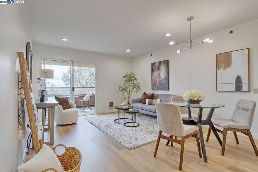 Spectacular Views of the bay on the Hayward Hills! Enjoy magnificent, year-round sweeping views from your private balcony and bedroom in this newly and elegantly remodeled top-floor condo. Nestled in the serene Hayward Hills, just below Garin Regional Park, this home offers modern upgrades and a tranquil lifestyle. Step inside to a brand-new kitchen featuring quartz countertops with a stylish backsplash, stainless-steel sink, and sleek appliances. The spacious bathroom boasts an oversized vanity with quartz counter and new shower doors. Additional highlights include a walk-in closet, recessed lighting, chic light fixtures, luxury laminate flooring, fresh interior paint, new baseboards, and in-unit laundry. Relax on your private covered patio or take advantage of community amenities including a pool, spa, gym, and clubhouse. Outdoor enthusiasts will love the nearby parks with tennis courts and scenic walking trails. Perfectly located just minutes from shops, dining, public transportation, and Cal State East Bay, with easy access to I-580, I-880, the San Mateo Bridge, and BART. No rental restrictions! This stunning home combines comfort, style, and convenience - and it won’t last long! 360VT: https://tinyurl.com/yc4udam6