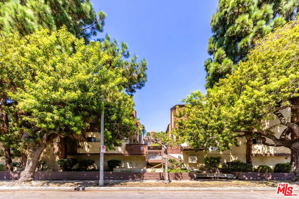 Welcome to 12601 Matteson, an impressive townhome residence perfectly positioned in the highly sought-after Mar Vista neighborhood. This wonderful home showcases high ceilings, stylish wood floors, recessed lighting, and thoughtfully updated kitchen and baths. An inviting foyer leads to the expansive main living space featuring wood floors, a decorative fireplace with wood mantle, a neutral palette, and glass doors opening to the private patio. The well- appointed kitchen boasts ample cabinetry, stone countertops, stainless steel appliances, a farmhouse sink, built-in microwave, and seamlessly flows to the dining area highlighted by a designer light fixture and focal wall. A chic powder room completes the main level. Upstairs, the generous primary suite features a vaulted shiplap ceiling, crown molding, a custom paneled mounted headboard, mirrored closets, and an ensuite bath. The comfortable second bedroom features a vaulted ceiling, recessed lighting, extensive wall storage, and its own ensuite bathroom. On the lower level, discover a large third bedroom or versatile bonus/flex space ideal for a home office, den, or creative space with two closets, laundry area with full size washer/dryer, and direct access to the parking garage with two side by side parking spaces. All this in an amazing Mar Vista location, moments from renowned beaches, top dining, and endless entertainment.