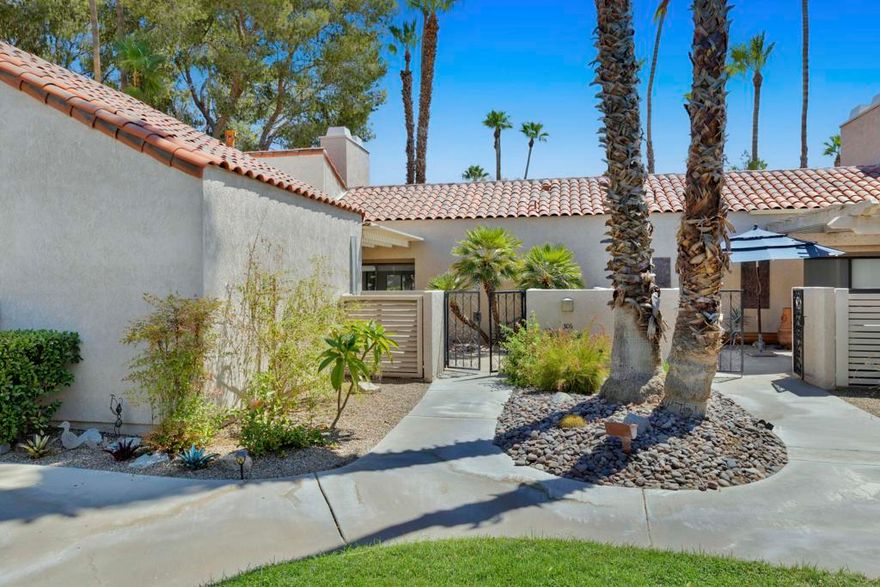 Enjoy resort-style living in this beautifully appointed 2-bedroom, 2-bath Tennis Villa located in the exclusive Mission Hills Country Club. Furnished and thoughtfully designed, this home features vaulted cathedral ceilings, updated tile flooring, and abundant natural light throughout. Highlights: Located steps from the pool and hot tub, Primary suite with fireplace, soaking tub, walk-in shower, dual vanities, and separate closets, Second bedroom with en-suite bath and walk-in closet, Spacious private courtyard for seamless indoor-outdoor living, Living room with fireplace, wet bar and sliding doors to the courtyard, KitchenAid stainless steel gas range and ample cabinetry, Large laundry room and detached 2-car garage. HOA: Roof, Landscape, Spectrum package, 4 pools and Spas and Guard Gate. Social and Sports/Fitness Center requires a separate membership.