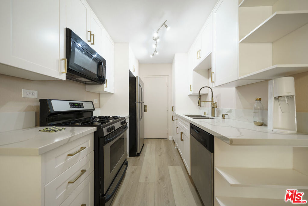 Beautifully remodeled 1-bedroom, 1 bathroom unit with approximately 800 sq.ft of living space, located in a quiet courtyard-facing part of the building. Fully renovated in 2023, this unit offers a modern and comfortable living environment. Features include: Upgraded kitchen with sleek handless cabinets and pull-out drawer shelving, updated bathroom, ceiling fan and quiet ventilation system, Multiple closets, including a spacious walk-in closet. HOA dues include: water, gas and building/common area maintenance, evening and overnight security staff, professional management by in-sight property management. The building offers secure entry, elevator access, laundry facilities and gated parking. Conveniently located near Koreatown and Downtown LA with easy access to shopping, dining, and public transit.