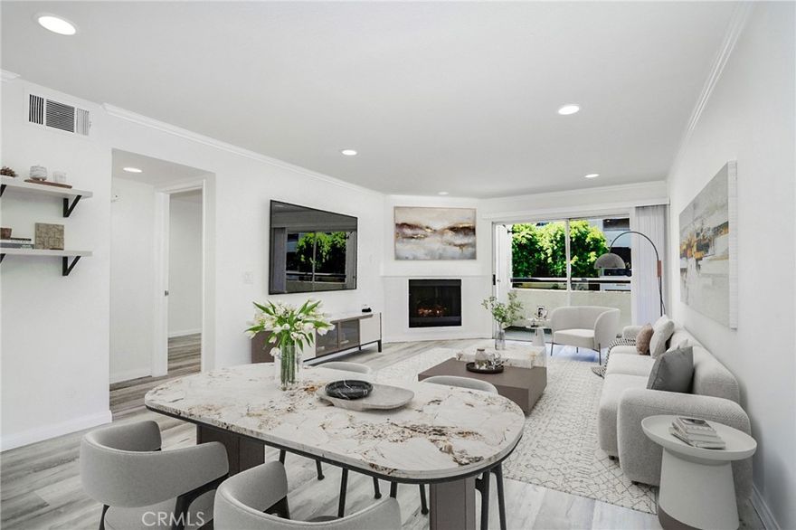 Resort style living in the heart of Warner Center, welcome to The Met! Immaculate 2 Bed + 2 Bath condo located on the 1st floor of building #2. Turn key West facing unit drenched in natural light, walking distance to the main pool, gym & tennis courts. Certainly the most desirable floor plan, this style utilizes an open concept with a guest bedroom and full bath up front, while the master sits at the back of the unit with views of the exterior! The master bedroom also offers a luxurious en suite bathroom featuring updated tile flooring with double vanity sinks in addition to an enormous closet. This spacious and beautiful condo features such upgrades as luxury vinyl plank flooring (NO CARPET), recessed LED lighting throughout, gas fireplace, granite countertops & stainless steel appliances. Designated dining room for more formal eating yet with open views to the living area and outdoor space. A peaceful West facing balcony sits off the living room, ideal for a BBQ and/or outdoor sitting area. Last but not least, your very own WASHER & DRYER IN THE UNIT, 2 COVERED parking spaces in the garage below & extremely close proximity to the lobby elevator!!! The Met is a guard gated community that offers 4 resort-style swimming pools, six night lighted tennis courts, full fitness center, racquetball, indoor basketball court, multiple spas & 24 hour guard gated security. All this located within walking distance to The Village, Warner Center Park and all the dining, shopping & entertainment Warner Center has to offer.