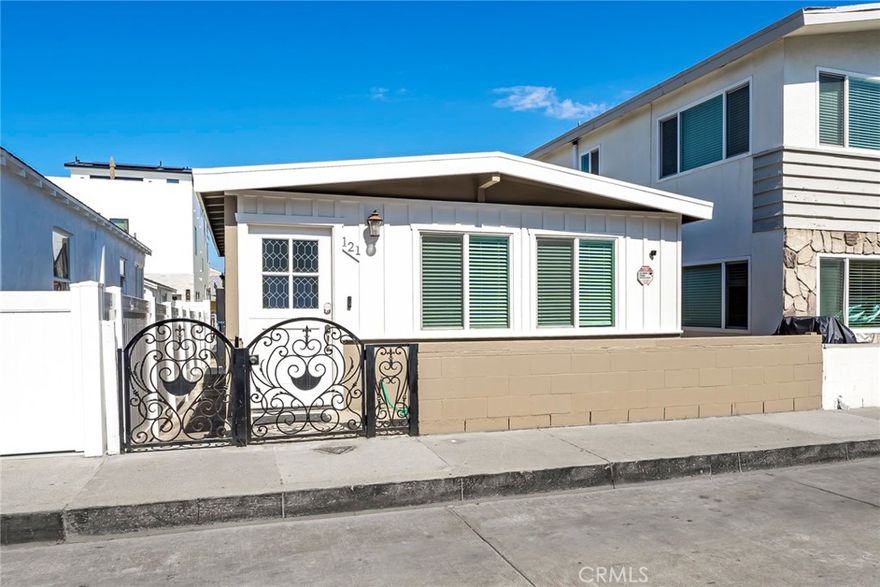 Characterized by cottage charm and nestled in the heart of the peninsula this fully remodeled and turnkey home is ready for summer year round. This cozy haven features two inviting bedrooms, perfect for unwinding after a day by the beach. The full bath is designed with comfort in mind, ensuring a refreshing start to any beach adventure. Gather around the warm, welcoming fireplace that serves as the centerpiece of the living area, ideal for cozy evenings. Just steps away from the shimmering sands, this property provides the quintessential California beach lifestyle. Large windows invite a flood of natural light, enhancing the airy, open feel of the space. The well-appointed interiors blend style and functionality, creating a seamless flow throughout the home. Whether you're enjoying the nearby vibrant community or relaxing in your private sanctuary, this rental is a delightful experience. One car garage space included.