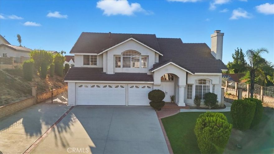 Enjoy breathtaking panoramic mountain views from this exceptional residence in the prestigious Canyon Crest Hills community — a tranquil cul-de-sac retreat designed for those who seek both elegance and comfort. Offering 2,658 sq. ft. of living space on an expansive 11,761 sq. ft. lot, this home features a large 3-car garage (approx. 588 sq. ft.) and an oversized front yard with potential RV parking, making it as practical as it is luxurious.From the moment you enter through the grand double doors, you’re greeted by soaring vaulted ceilings and expansive picture windows that fill the interiors with warm, natural light—creating an ambiance of sophistication and serenity. The formal living room with brick fireplace and adjacent dining room set the stage for elegant entertaining, while the open-concept family room with a second fireplace offers the perfect space for relaxed everyday living. The gourmet kitchen features tile countertops, generous cabinetry, and a charming breakfast nook overlooking the lush backyard—perfect for peaceful mornings or lively gatherings. Lustrous luxury vinyl flooring flows throughout, enhancing the home’s modern appeal. A highly desirable downstairs ensuite bedroom provides comfort and flexibility for guests or multi-generational living, complemented by a separate powder room. OUTDOOR SANCTUARY: The exterior has been lavishly upgraded with premium artificial turf and designer Rocks cape in both the front and back yards — delivering a water-efficient yet visually stunning landscape. Beyond the finished areas lies wide-open space, offering endless potential to create your ultimate oasis — pool, outdoor kitchen, meditation garden, or play retreat. UPGRADES & HIGHLIGHTS: • Newly installed waterproof SPC flooring



 • Built-in cabinetry in the laundry room



 • Fresh interior paint & updated finishes throughout



 • New toilets, new dishwasher, new water heater



 •  Lennox 5-ton central AC & heating system



 • Pool-size yard with fruit trees & RV parking potential

THE LIFESTYLE: Situated in an award-winning school district, this home offers the ideal setting to raise a family or entertain in style. Just minutes from upscale shopping, fine dining, gyms, golf courses, parks, and the 91 / 60 / 215 freeways — convenience and luxury meet effortlessly. This is more than a residence — it’s a statement of refined living. Come experience it before it’s gone.