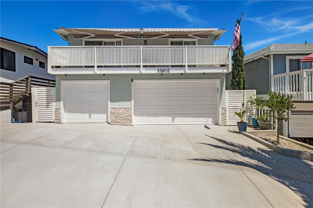 Welcome to 33802 Violet Lantern, Unit C – an exceptional two-bedroom, two-bathroom lease opportunity in the heart of Dana Point’s desirable Lantern District. This lower level unit offers a fresh, modern interior paired with ocean views and cooling coastal breezes. Located just a short distance from the shops, restaurants, and charm of downtown Dana Point, the location is as ideal as the home itself. Part of a meticulously maintained building completed just two years ago, this unit features spacious nine-foot ceilings, LED lighting throughout, and an energy-efficient mini-split system for customized heating and air conditioning. The kitchen and bathrooms have been tastefully updated with all the modern finishes, and the layout offers comfort and privacy while enjoying the Beach lifestyle. The open-concept living space flows seamlessly onto an expansive private deck, ideal for entertaining or relaxing, with built-in outdoor heating that lets you enjoy the ocean air year-round. The home includes an instant hot water system, in-unit washer and dryer, and a dedicated driveway parking space. Solar power keeps utility costs impressively low—averaging around $25 per month—and water, trash, and sewer are included in the rent as well at two parking spaces in the driveway and additonal storage shed for personal items. With pride of ownership evident in every detail and regular maintenance ensured, this recently built coastal retreat combines modern convenience with everyday comfort in one of Dana Point’s most sought-after neighborhoods