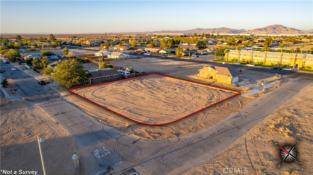 Welcome home! This nearly 18,000 sqft, RM-12, parcel is driving distance to the nearby Adelanto airport and Joshua Tree Nation Park. This corner flat parcel is zoned multi density and has a fire hydrant in front of the parcel. Neighboring properties are houses and are on public sewer and public water. Neighboring properties appear to be houses with connected to the home. Parcel does not have existing address, buyer to do all investigations.