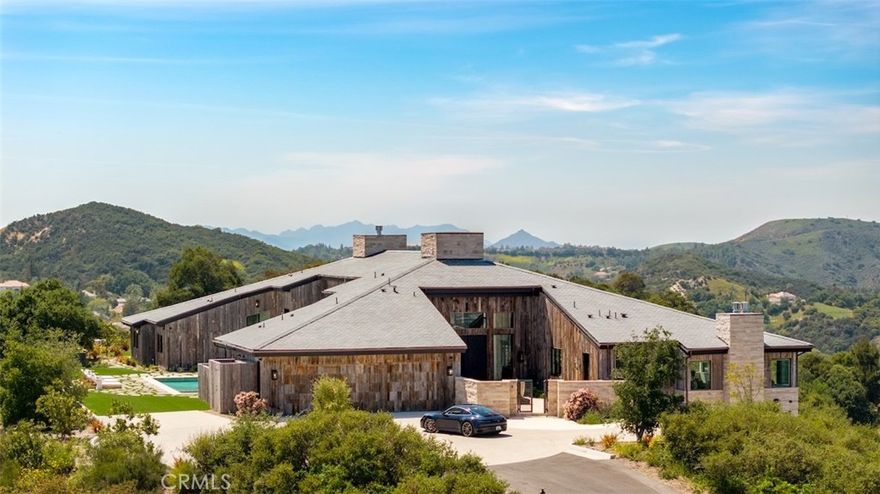 Introducing Skycrest—a breathtaking, brand-new construction spanning nearly 9,000 square feet and never before lived in. Perched above the city with panoramic views from every room, this architectural masterpiece showcases the pinnacle of modern innovation and organic design. Framed by collapsible walls of glass, the home seamlessly transitions between indoor and outdoor living—whether you're gathered around the fire pit gazing at city lights or relaxing beside the pool with endless canyon views as your backdrop.

Thoughtfully designed in an X-shaped layout by renowned architect Robbin Hayne, Skycrest was inspired by the natural convergence of form and function. Each bedroom is a private suite with its own courtyard, while the luxurious primary retreat features a dedicated outdoor spa and lounge. The home’s interior offers an exceptional array of amenities, including soaring 24-foot ceilings, reclaimed wood from Wyoming, a private movie theater, a climate-stable wine cellar, a separate butler’s kitchen with private entrance, and a relaxation lounge and bar—perfect for unwinding or entertaining guests in style. Technology and convenience meet seamlessly through Control4 smart home automation and a 16-zone surveillance system.

Entertain with ease thanks to a resort-style pool and spa, firepit, outdoor barbecue area, and a poolside changing station with a full bath. Security and privacy are paramount, with gated road access and two nearby fire hydrants offering added peace of mind. The estate also includes winery-ready grounds and the potential to expand—two previously entitled lots are available for separate acquisition, ideal for a custom residence, private sports court, or simply enhancing your sanctuary on nearly 15 acres.

Skycrest offers a living experience as awe-inspiring as its surroundings, where every line, material, and view is intentionally crafted to elevate luxury living to a new dimension.