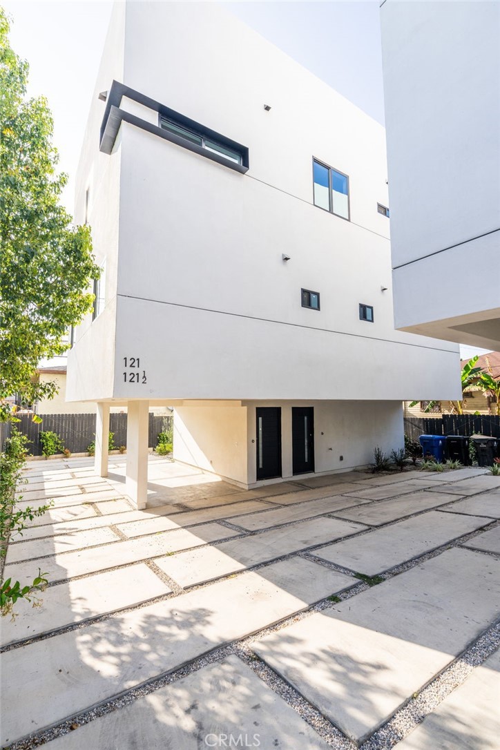 Standing three stories over a celebrated neighborhood in Rampart Village, this ambitious 1,241 sq ft home is the quintessential Modern Residence. Delivering the outmost in luxury and exclusivity, this three-bedroom, two bath Townhome gazing out across the dazzling Hollywood landscape presents a rare new construction homeownership opportunity. A truly astonishing accomplishment of engineering and architecture, the open-plan layout blends premium craftsmanship with exceptional finishes. Exhibiting a stunningly executed design, every inch of this sumptuous space has been meticulously crafted for sophisticated living. Dominated by khaki-hued hardwood floors and crowned by elevated ceilings with integrated lighting, the elegant living room and dining room are vibrant entertaining venues. Rich in high-end finishes and fixtures, the kitchen is a first-class workspace. Characterized by a superior standard of quality, no expense was spared to achieve this epicurean’s delight. Amenities include chic matte cabinetry, professional series appliances, and double pantry. Outstanding accommodations continue in the additional guest rooms, which can efficiently function as home offices or fitness areas. A full-width private roof deck is positioned to capture miles of twinkling L.A. lights. Bike storage, a rock garden, secure parking and keyless entry provide the finishing touches. The enviable location takes full advantage of its proximity to thriving business and cultural scenes in adjacent Silverlake, Koreatown, and Westlake. Dodger Stadium and L.A Live can be reached in 10 minutes, while upscales boutiques along The Grove's promenade are just a 19 minute commute.