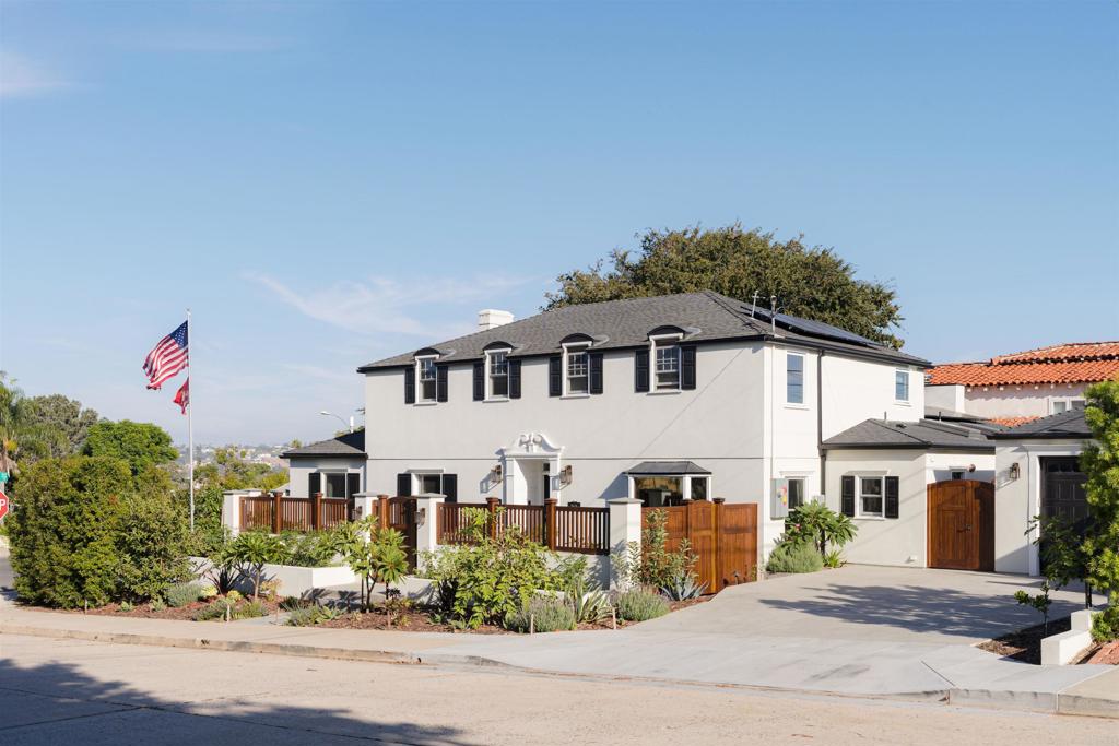 Situated on a large corner lot in Loma Portal just steps away from Plumosa park, and minutes from Liberty Station, downtown Point Loma, Shelter Island, Cabrillo National Park, and Sunset Cliffs. This is virtually a new home in every way including fully paid for Solar! Brand new finishes throughout, including all new wood framed windows, custom Huayruro Peruvian wood shutters, gates and fences. The facade has been completely transformed with a custom Tornilla carved entryway and brand new acrylic stucco on the exterior. Impeccably landscaped, yet low maintenance yard, including an all drip irrigation system and a plethora of fruit trees; orange, lime, tangelo, lemon, tangerine, fig, apple, guava, avocado, apricot, blackberries, raspberries, passion fruit, vegetable, and herb garden. The kitchen has been fully upgraded, to include custom Spanish cedar cabinets, high end stainless steel appliances, and Silestone quartz countertops. Boasting tall ceilings and La Cantina doors that invite you into the indoor/ outdoor backyard living area. The back patio cover is custom tongue and groove Peruvian hardwood. Perfect for entertaining, complete with electric heaters, wood and gas burning fireplace, spa and outdoor shower, built-in BBQ area with sink, refrigerator, and warming drawer, volt landscape lighting system, automated exterior lights, and outdoor speaker system connected to the main house. Newly constructed detached finished garage with 9’ ceilings, front and rear 8’ roll up doors, speakers wired to the main house, ample storage, additional outlets, and sink.