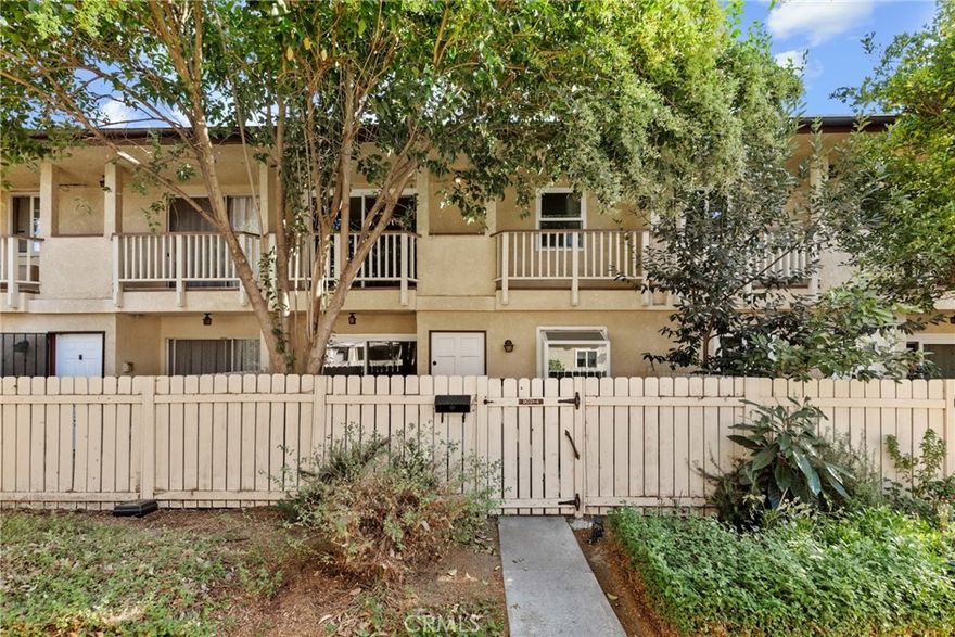 Welcome to Northridge Village—an exceptional gated community where comfort, convenience, and style come together. This beautifully updated 3-bedroom, 2.5-bath townhome sits in a prime interior location of the complex, offering the peace, privacy, and modern touches today’s buyers love.

Step inside to a bright, inviting living space featuring new paint, updated flooring throughout, and newer dual-pane windows that enhance comfort and energy efficiency. The spacious living room, complete with a cozy fireplace, flows seamlessly to a large private patio—perfect for outdoor dining, entertaining, or unwinding after a long day.

The adjacent dedicated dining area complements the updated kitchen, which boasts granite countertops, ample cabinetry, and generous storage. A convenient powder room and direct-access multi-car garage with laundry complete the well-designed first floor.

Upstairs, discover all three bedrooms, including an impressive primary suite with its own full ensuite bath and a private balcony overlooking the community grounds. Two additional well-sized secondary bedrooms share a clean, modern full bath—ideal for family, guests, or a home office setup.

Residents of this pet-friendly community enjoy a wealth of resort-style amenities: multiple sparkling pools, a private clubhouse, playground, and beautifully landscaped greenbelts perfect for evening walks and weekend relaxation.

Unbeatable location! Close to major freeways, public transit, top-rated schools, local hospitals, and just minutes from CSUN, this townhome offers the ideal blend of residential tranquility and urban accessibility. Whether you're commuting, studying, or exploring nearby shops and restaurants, everything you need is within easy reach.

Move-in ready —this is the townhome you've been waiting for. Don’t miss your chance to call this Northridge Village gem your own!