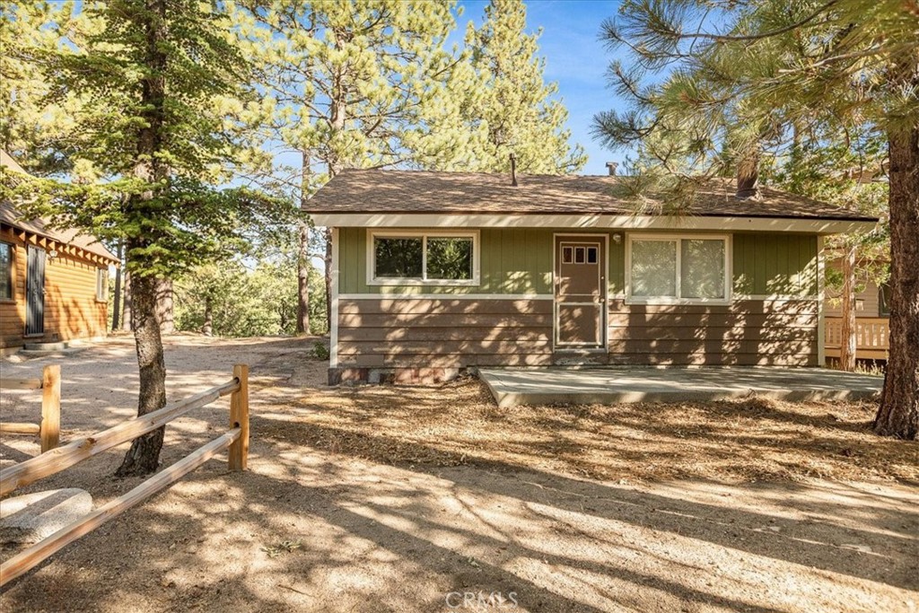 Cozy Mountain Cabin in Green Valley Lake
Escape to your simple, low-maintenance retreat! This level-entry, single-floor home features no decks to worry about—just durable concrete at the front and rear. A large driveway offers plenty of parking for multiple vehicles. Nestled among trees, the property boasts tree-lined views on a spacious 6,000+ sq ft lot, providing plenty of privacy and elbow room. Inside, you'll find 2 bedrooms, 1 bath, forced air heating, and an on-demand water heater for energy efficiency. Green Valley Lake offers fishing and swimming just minutes from your door, perfect for outdoor lovers. Enjoy fresh mountain air and tranquility—just 38 minutes from Big Bear, 29 minutes from Lake Arrowhead, and slightly over an hour and a half from LA and Orange County. Experience the serenity of mountain living! **Pictures of Green Valley Lake are stock and do not reflect the view from the property**