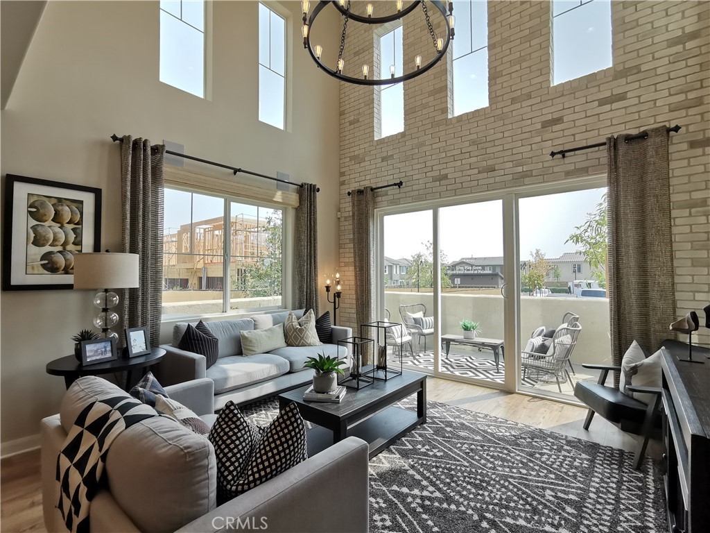 Stunning Previous Model Home in Desirable Day Creek Square Community. The gorgeous PALAZZO END UNIT model home located in the Prime location with no home in the front of the property. Highly upgraded three storied moden home has the most popular floor plan with high ceilings. very bright and airy. There are a lot of upgrades within this most expensive model home. Three spacious bedroom suites plus the large powder room on the first floor. Spacious roof top balcony with the best view within the whole community. there are also upgarded office/game room on the third floor with the wine cellar. Upgraded hardwood flooring through out the house. Enjoy the exceptional community amenities, including a sparkling pool and spa with lounge seating, dining areas, a tot lot, and BBQ spaces for gatherings. Walking distance from upscale Victoria Garden Mall with famous restaurants and shopping and minutes away from Metro-link train station. Also close to the 210 and 15 freeways, Excellent school district. Come and experience the modern luxury plus unbeatable convenience!