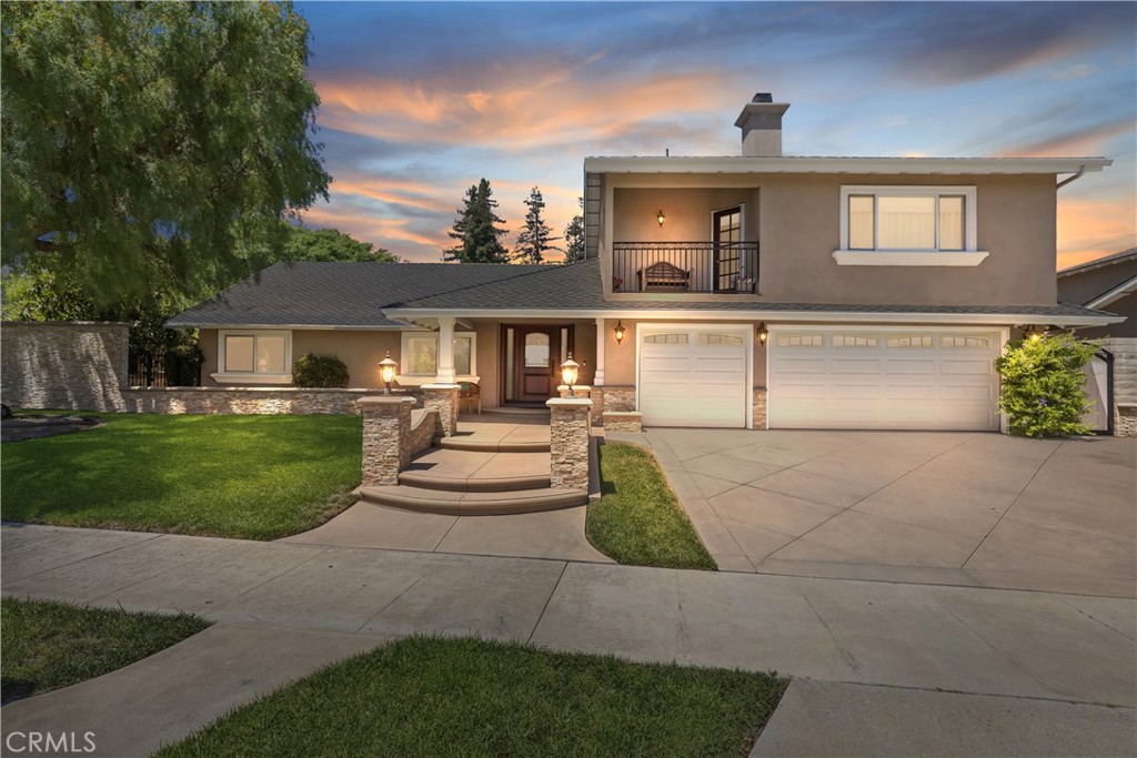 Highly Upgraded Dream Home In Prime Orange Location !!! Welcome to 5215 East Playano Avenue - a meticulously upgraded move-in ready residence that blends luxury, functionality and timeless design. This stunning home features two master suites (one up and one down), perfect for multigenerational living or guest privacy. Step inside to discover a fully renovated interior featuring custom cherry wood cabinetry, quartz countertops, and Bosch appliances in a chef's kitchen. The large island includes pull-out drawers, under-cabinet lighting, and LED pendant lights, perfect for entertaining. The home also boasts a newer HVAC system with zone control, all new ducting, LED lighting throughout, solid core interior doors, whole-house crown molding, ceiling fans, and a tankless water heater. The exterior is equally impressive with a newly poured, rebar-reinforced driveway, matching hardscape, and a charming backyard flagstone patio. The upgraded perimeter wall ensures privacy, and mature fruit trees add a touch of nature. Additional features include LED lighting, new balcony railing, insulated windows and sliders, and a custom front door. The home truly has it all !! Don't miss the opportunity to make it yours.