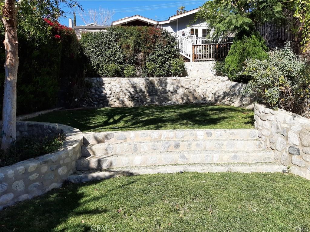 “We have been searching for our perfect place for so long. Can you help us? Is it too much to ask for a home with a view of a mountain, two bedrooms one bath, a country kitchen, hardwood floors, and a cathedral ceiling? We want a natural private world where we can do our art and open the French doors to the gardens so the dogs can run free on the grass. Here are the keys to your dream house. Go up the mountain to 4827 Mendota Avenue. The rest--is up to you.”