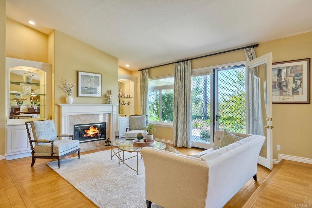Elegant Single-Story with Scenic Views in Shadowridge Set on a generous 0.65-acre lot, this beautifully remodeled, move-in-ready home offers the perfect blend of luxury, comfort, and picturesque charm. Located in the highly desirable Shadowridge community, the property showcases expansive panoramic views and a thoughtfully designed open-concept layout with vaulted ceilings, French doors, and large windows that bathe the interior in natural light. The heart of the home is the gourmet chef’s kitchen, featuring custom cabinetry with pull-outs, granite countertops, stainless steel appliances, a double oven, warming drawer, built-in microwave, gas cooktop, and a spacious center island with breakfast bar—ideal for entertaining or casual dining. The open living, dining, and family rooms create a seamless indoor-outdoor flow and overlook the lush backyard landscape. The private primary suite is a true retreat, with French doors leading to the serene yard, a custom-built closet system, and a luxurious en suite bath adorned with high-end finishes. Two oversized secondary bedrooms offer exceptional space and comfort, complemented by two stylishly updated full bathrooms. Step outside to your own backyard oasis—complete with two Alumawood patio covers, an adjustable shade structure, tranquil fountain, and a built-in natural gas BBQ island—all set against stunning sunset views. The expansive lower yard features a variety of fruit trees, including lemon, orange, avocado, apple, plum, and pear. Additional features include engineered hardwood flooring throughout, a newer A/C and furnace, a brand-new water heater, and an oversized three-car garage. Enjoy access to nearby pickleball, tennis, and basketball courts, as well as scenic nature trails—all just a short walk away. This rare gem has it all: scenic views, premium updates, and an unbeatable location. Schedule your private showing today!