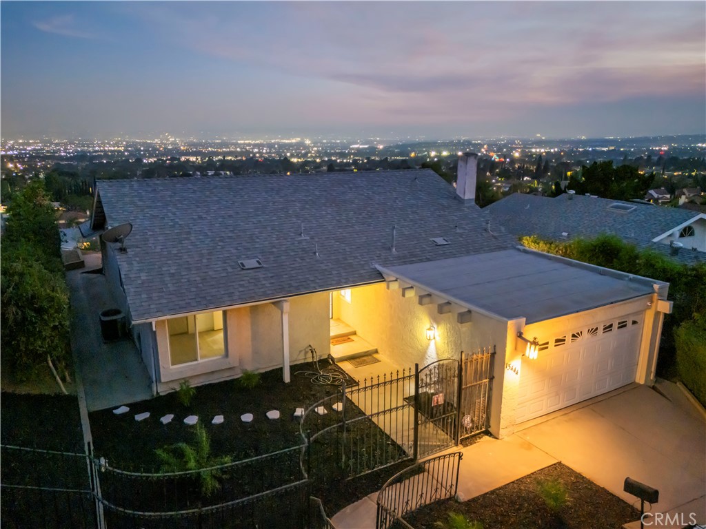 Introducing you to an extraordinary opportunity to own a breathtaking 3-bedroom, 2-bathroom home nestled in one of Sylmar’s most desirable neighborhoods. This remarkable residence effortlessly combines modern elegance with unparalleled comfort, making it the perfect sanctuary for you and your family. Step inside and be captivated by the thoughtful updates that breathe new life into this home. Brand new windows invite abundant natural light to dance across the gorgeous hardwood floors, while recessed lighting adds a warm, inviting glow throughout. The fully remodeled kitchen is a chef’s dream, equipped with sleek, modern appliances and stylish finishes that inspire culinary creativity. The spacious primary suite is a true retreat—a private haven featuring an attached spa room enclosed in glass sliders. This unique design floods the space with sunlight and offers serene, unobstructed views, creating the ultimate spot to unwind and rejuvenate after a long day. The heart of the home beckons with an open floor plan that effortlessly connects the grand living room, dining area, and cozy family room. Vaulted ceilings enhance the sense of space, while nearly wall-to-wall sliding glass doors frame stunning panoramic vistas of the valley below. The inviting fireplace in the family room sets the perfect ambiance for relaxing evenings or memorable gatherings with loved ones. Step outside into your very own backyard oasis, where a sparkling pool awaits you. Positioned to capture sweeping views, this outdoor retreat is an idyllic spot to soak up the sun, entertain guests, or simply enjoy tranquil moments surrounded by nature. Every detail has been meticulously curated to elevate your lifestyle and provide a sanctuary you’ll be proud to call your own. Don’t miss out on this incredible opportunity! Contact us today to schedule a private tour and experience firsthand the magic of this stunning Sylmar home.