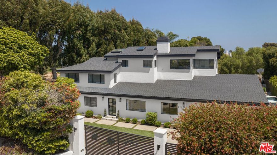 Indulge in the ultimate modern sanctuary. This newly renovated, Contemporary-style home has six bedrooms, six baths, living room, family room, large kitchen and an expansive yard. The primary suite offers beautiful ocean and mountain views with a cozy wood burning fireplace and dual walk-in closets. Includes a one bedroom, one bath guest suite, kitchen and private entrance. The garage houses up to three vehicles and has ample storage with a lounge area, perfect for entertaining! Additional parking inside the private gate. **Pool permits in process**