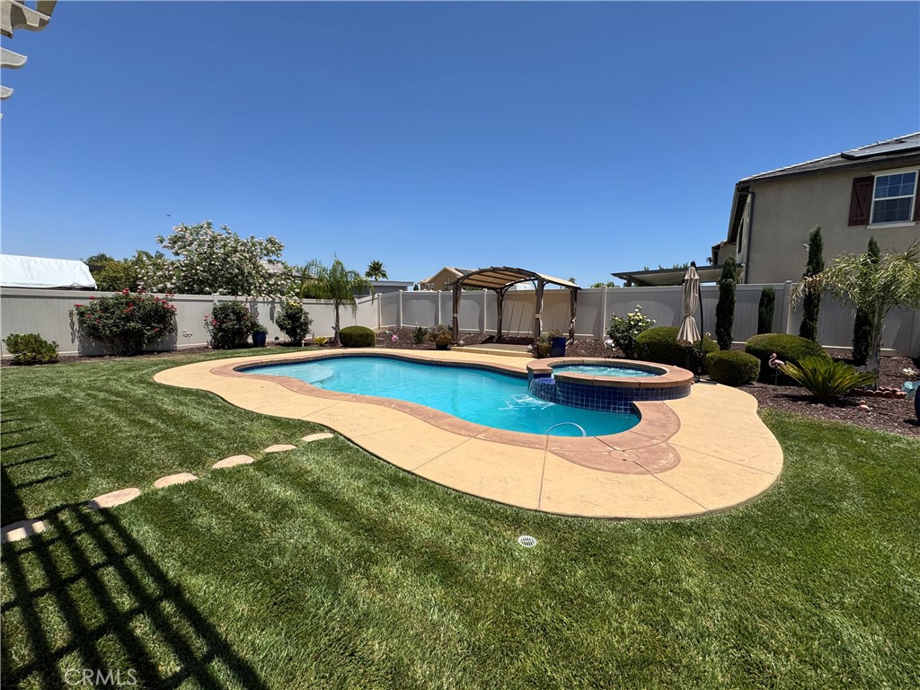 Welcome to 3469 Presidio Lane, a beautiful two-story home that combines comfort, style, and convenience in Perris. This inviting residence offers three spacious bedrooms, two and a half bathrooms, and an open floor plan designed for today’s lifestyle. The living room features a cozy fireplace and flows seamlessly into the gourmet kitchen, a center island, and plenty of space for cooking and gathering. The main floor includes a multi-purpose bonus room that works beautifully as a home office or private guest retreat, while an additional half bathroom adds extra convenience. Upstairs, you’ll find a large loft with a built-in desk area, a spacious laundry room, and generously sized bedrooms. The primary suite provides a relaxing retreat with an oversized bathroom featuring a walk-in shower, soaking tub, and a large walk-in closet. Step outside to your private backyard oasis, complete with a lush lawn, a heated pool and jacuzzi, and a covered patio ideal for entertaining or unwinding at the end of the day. Landscaping and pool maintenance are included, allowing you to enjoy outdoor living without any hassle. This home is perfectly located near excellent schools, parks, shopping, dining, and just a short drive from Lake Perris, hiking trails, and the Perris Skydiving Center. Major freeways are also nearby for an easy commute. Don’t miss the opportunity to make this wonderful home yours — schedule your private showing today!