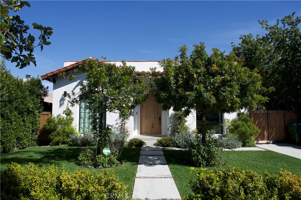 Welcome to 5142 Brynhurst Avenue, a fully reimagined Modern Spanish retreat by Beau Casa in the heart of Los Angeles. This 4-bedroom, 3.5-bath home masterfully blends 1920s charm with refined contemporary updates, offering both elegance and ease. Step inside to soaring 10-foot ceilings, wide-plank European oak floors, and graceful archways that define the airy, open layout. Thoughtful designer touches—like curated lighting, custom-built-ins, and Zia tilework—bring character and warmth to every space. The chef’s kitchen is a showstopper, complete with a massive island, open shelving, brushed brass fixtures, and a premium 48” 8-burner Forno range, Kingston Brass pot filler, and faucet, making it the perfect hub for cooking, gathering, and entertaining.
A seamless indoor-outdoor flow leads to the lush, private backyard, featuring newly sanded and stained decking, mature landscaping that features a Japanese maple tree and olive tree, mood lighting, and a custom swim spa—ideal for year-round relaxation or al fresco dining. The primary suite offers a serene retreat with a spa-like bath, dual vanities, a freestanding tub, a walk-in closet, and French doors that open directly to the garden. Additional bedrooms include en-suite baths and flexible layouts that accommodate guests, work-from-home needs, or multigenerational living. Natural light pours into every corner, highlighting the quality finishes and timeless design choices throughout.
The property also includes a finished, detached garage with a private entrance—perfect for an office, studio, or future ADU. Ideally situated near Culver City, DTLA, SoFi Stadium, Kenneth Hahn Park, and major cultural and tech hubs, this home offers the perfect blend of privacy, character, and convenience. 5142 Brynhurst is more than just a beautifully designed home—it’s a lifestyle upgrade in one of LA’s most desirable up-and-coming neighborhoods.