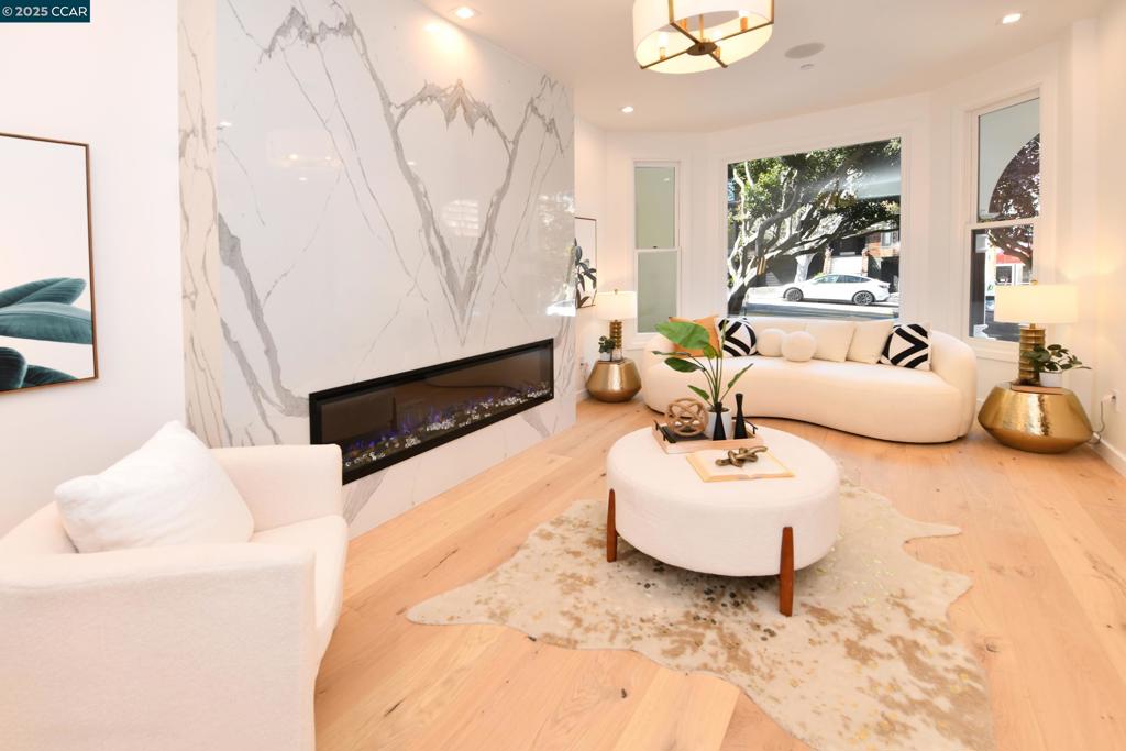 Located in the heart of THE PACIFIC HEIGHT, this beautiful Victorian is renovated from ground up. This modern & sophisticated home is packed with high-end appliances, luxurious materials, & finishes. The first floor offers a foyer, living room, a family room, dinning room with a wine cellar, and gourmet kitchen with an island. From the family room, a wide staircase with glass railings gives access to the basement and connects to the second floor with a second family/study/guest room (which offers a full guest bath), a bedroom suite and a master suite with a shower and soaking tub. Continuing up the stairs, the primary suite has a view of downtown, a baby/office room, wet bar, two walk in closets, a secret room, air conditioning, a master bath with dual showers and a soaking tub. The lower level offers a gym/guest bedroom, full bath, sauna, laundry closet, half bath, and a recreation room/ballroom with media walls and a kitchenette. Through the glass sliding door, the landscaped yard incorporates two party sized decks & a redwood fence. This extraordinary 4 story house impresses many with windows and sliding glass doors intricately designed on the balconies at each level. This captivating modernized Victorian is one of a kind that is suitable for luxury living & social gatherings.