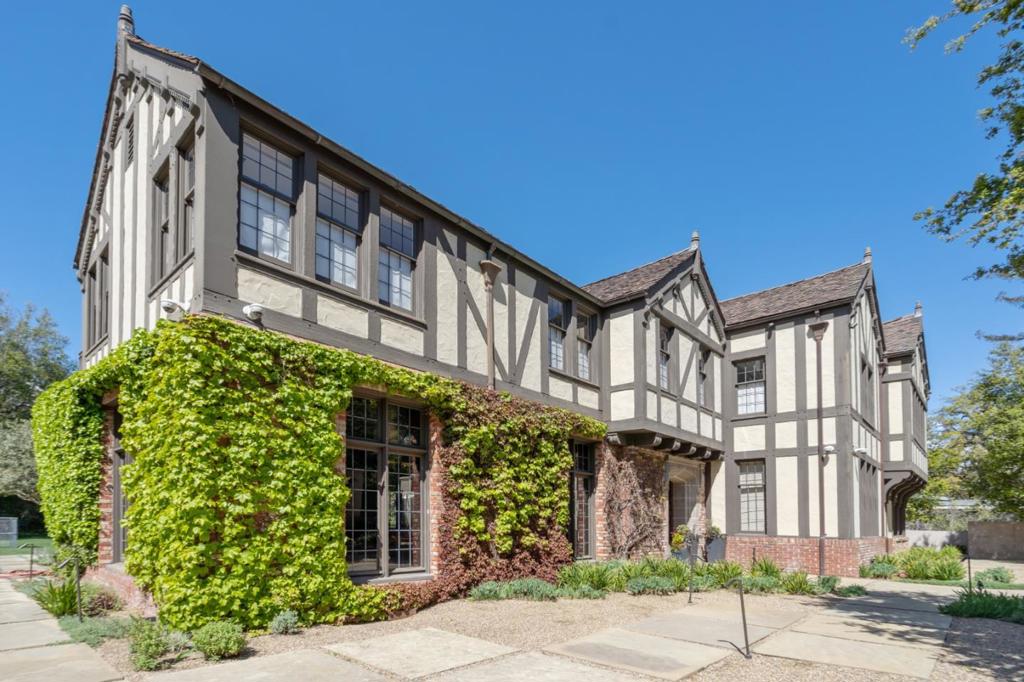 This English Tudor estate stands on 2 acres of immaculate formal gardens. A true exemplar of the Tudor style while maintaining todays modern lifestyle. This estate is entered via a private gate with scenic grounds while showcasing the private compound spanning over 10,000 square feet of living space. Set on 4 levels, this property features 7 bedrooms, 6 bathrooms, 3 half bathrooms, library, home offices, custom home theater, chefs kitchen and a spacious family room. The guest home includes one bedroom, two bathrooms and an entertaining area surrounded by a pool, spa, firepit, tennis court, vegetable garden and outdoor kitchen perfect for entertaining and serene evenings. The original architecture has been meticulously maintained with upgrades to its entire design. Located on one of the most coveted streets in Hillsborough, this estate is a few minutes to downtown San Mateo.
