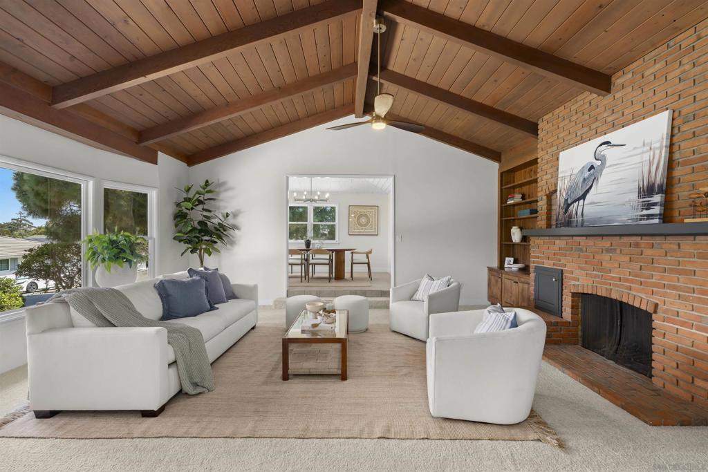 Charming Coastal Retreat in Point Loma's Wooded Area. Welcome to your dream home in the highly sought-after Wooded Area of Point Loma, where coastal charm meets modern luxury. Perched high on the lot surrounded by mature trees on a quiet, picturesque street. This beautifully updated ranch-style home offers the perfect blend of privacy, sustainability, and style. Step inside to find a fully remodeled kitchen featuring quartz countertops, custom cabinetry, stainless steel appliances, and an open-concept layout that flows effortlessly into the living and dining areas—ideal for entertaining or relaxed family living. This light-filled home boasts energy-efficient solar panels, significantly reducing utility costs while supporting eco-friendly living. Enjoy seamless indoor-outdoor living with multiple patio spaces, ideal for dining al fresco, morning coffee, or simply soaking in the peaceful, tree-lined surroundings. Privacy and peace are high due to the property being backed up to the Naval Base. Additional highlights include updated bathrooms, hardwood flooring throughout, a spacious primary suite, and a beautifully landscaped yard that offers both tranquility and usable outdoor space. Just minutes from Sunset Cliffs, Liberty Station, and top-rated schools, this location offers a true coastal lifestyle with the comforts of a quiet, established neighborhood.