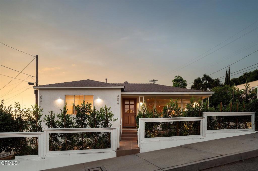 Set on a 9,417 sq ft double lot in the hills of Mount Washington, this private compound by Bungalowe blends design-forward living with layered outdoor moments and flexible space to live, create, or host. With canyon views, curated landscaping, and two distinct structures, this is a full experience, not just a home.The 1,210 sq ft main house offers 2 bedrooms and 2 bathrooms, featuring a custom chef's kitchen with a patinated copper island, integrated sink, and brass fixtures. Smooth concrete walls, Everhem shades, designer lighting, and built-ins add warmth and intention throughout. Major system upgrades include plumbing, electrical (200 amp), HVAC, tankless water heater, smart features, and sprinklers.The fully permitted 366 sq ft ADU sits across the garden with its own entrance, vaulted ceilings, kitchenette, full bath, laundry hookups, and mini-split. It's ideal for guests, in-laws, a creative studio, or rental income.Outdoor moments include multiple lounge areas, Olive Atelier water features, mature fruit trees, a vegetable garden, privacy hedging, and five off-street parking spots. Griffith Observatory views and golden sunsets bring a sense of calm and connection.You're just minutes from Highland Park, Glassell Park, and York Blvd. Start your day with coffee at Loquat, have dinner at Dunsmoor, and finish with a glass of wine at Wife and Somm.
