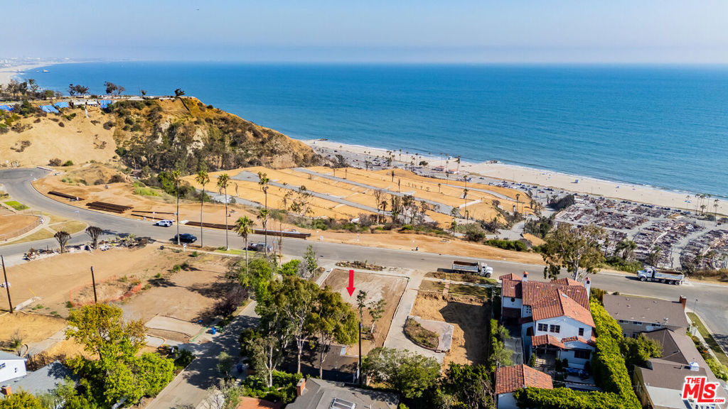 Rare opportunity to build your dream home on a prime 9,054 sq ft corner lot on one of Pacific Palisades' most sought-after streets. Located at the end of the El Medio Bluffs on prestigious Asilomar Boulevard, home to just 16 residences, this expansive lot offers sweeping ocean views. With Phase 2 debris removal already completed and the prior home measuring 4,012 sq ft, the property is ready for your vision. Whether you're planning a modern architectural masterpiece or a timeless coastal retreat, this site offers a stunning canvas to create something truly special. Enjoy the tranquility of bluff-top living, just moments from Palisades Village, top-rated local schools, Temescal Canyon Park, scenic hiking trails, and world-class beaches. A rare offering where extraordinary views, a premier location, and endless potential converge.