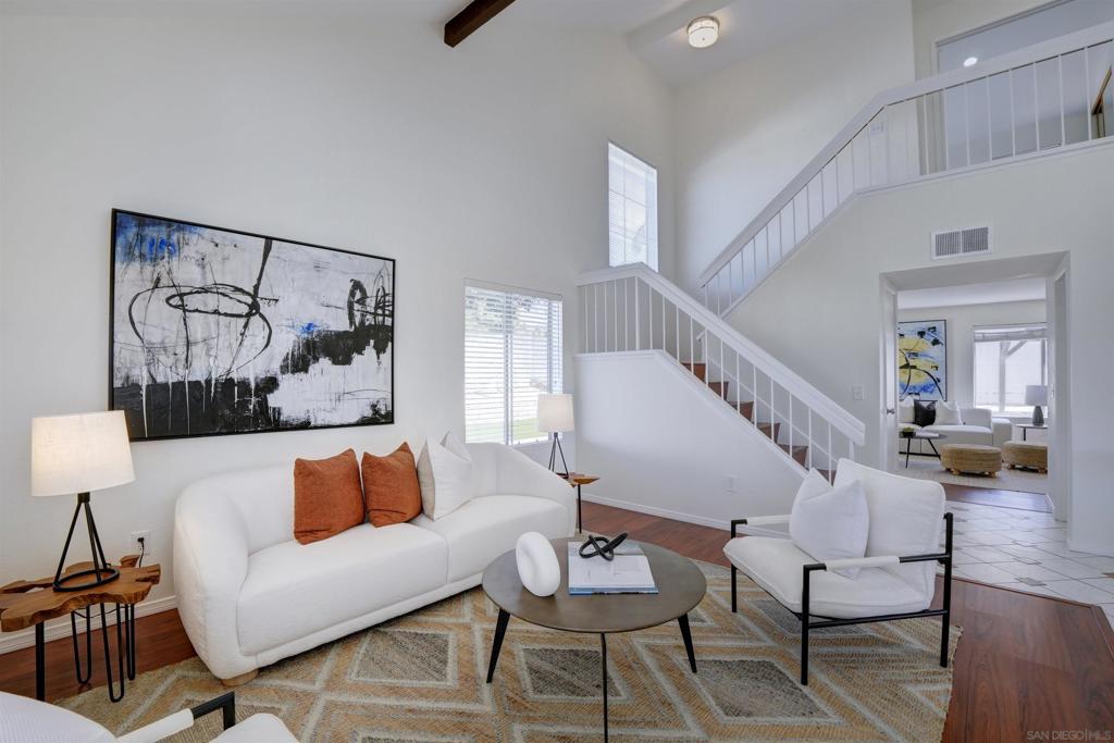 Tucked away on a quiet cul-de-sac in the highly sought-after EASTLAKE 1 community of Chula Vista, this spacious 4-bedroom, 2.5-bath, two-story home offers the perfect blend of comfort, style, and location. Step inside to soaring vaulted ceilings in the living room and foyer, where natural light pours through large windows, creating a bright and inviting atmosphere. The renovated kitchen boasts sparkling new countertops and modern finishes which are ideal for both everyday living and entertaining. Upstairs, you’ll find generously sized bedrooms and well-designed bathrooms that provide convenience and privacy for the whole family. Both the front and backyard are beautifully maintained, featuring brand new pavers, a large side yard with patio awning, a mix of drought-resistant plants, and artificial grass for easy upkeep.. all on a drip water systems. Living in EASTLAKE 1 means enjoying a resort-style lifestyle right at your doorstep. The community offers multiple swimming pools, tennis courts, basketball courts, and even beach volleyball courts, perfect for active families. Plus, you’re just minutes from parks, shopping, dining, and some of the top-rated schools in the county. Eastlake 1 isn’t your typical neighborhood. It's Perfect for families who like to stay active...or at least like the idea of it : ) This unique and special community offers lakes, paddle boarding, ducks, and a beach area with clubhouse. Families can enjoy quality time together at the beautiful beach area or rent the clubhouse for special gatherings, making it a perfect spot for parties and community events. Overall, EastLake I Community Association is a wonderful place to call home, boasting beautiful surroundings, community spirit, and a plethora of recreational options that cater to all ages.