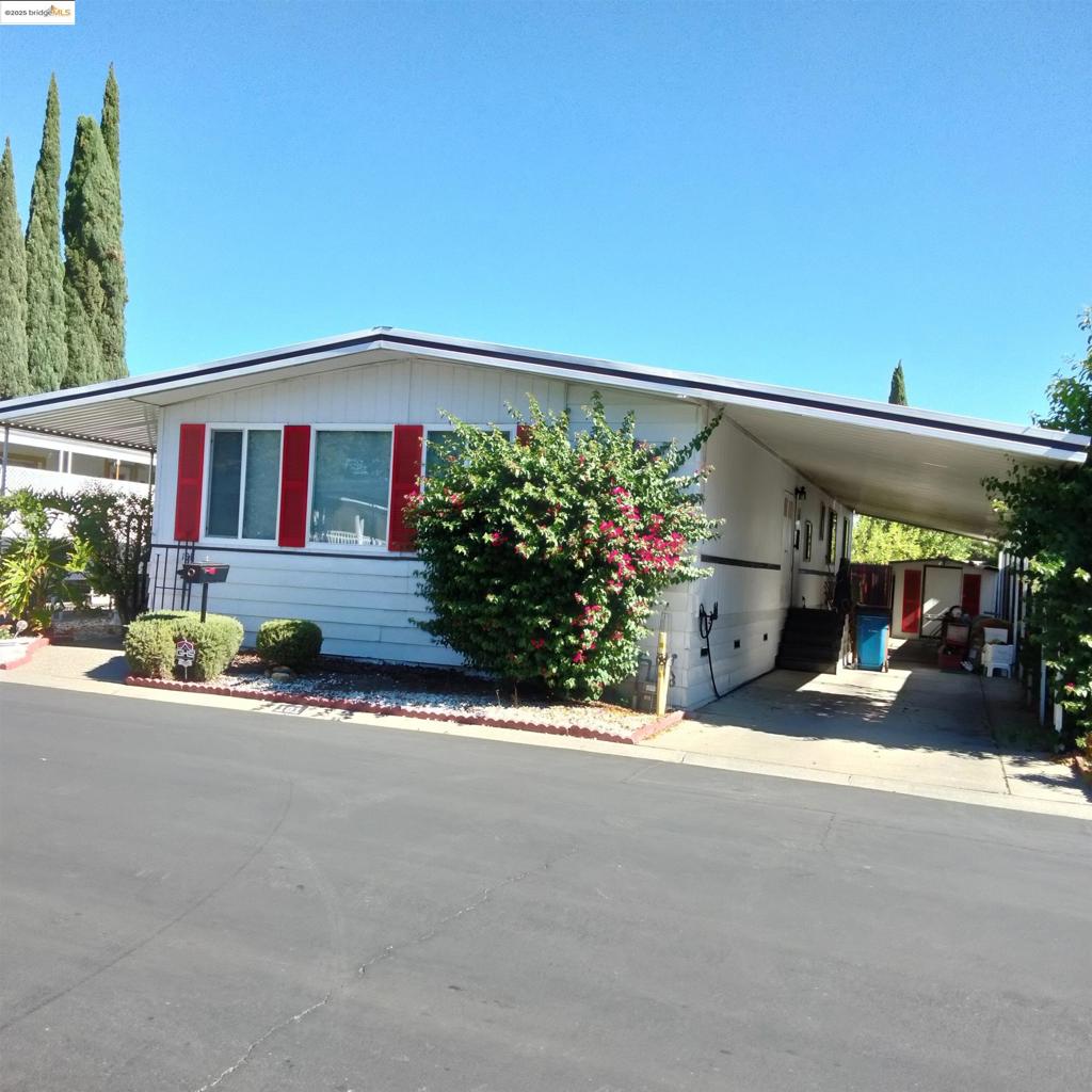 Senior 55+ Gated Mobile Home Park *Must be Park approved and income must be 3 times the amount of the rent *2 bed 2bath*Living room and dining room with lots of windows* Family room with fireplace enhanced with sliding glass doors to the deck and extra room that can be used as office/sunroom *Beautiful laminate floors throughout, updated kitchen with new top of line bottom freezer draw refrigerator* All appliances are included, lots of cabinets & storage!*This home in move in condition!* Lovely updated clubhouse with pool tables and swimming pool and spa. Some furnature can stay Fireplaces: FAM