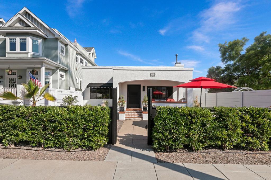 Live the Coronado Village lifestyle from this classic Spanish single-level just moments from everything. Leave the car in the finished 2-car garage and embrace a walkable routine where favorite restaurants and shops are just a short stroll away, the beach ~2 blocks west for morning surf checks or sunset walks, and schools ~3 blocks for easy drop-offs. Start the day with coffee on the elevated front porch, then host friends or family for dinner in your spacious and fully landscaped front yard; a true outdoor dining room. Prefer something quieter? The back patio off the kitchen offers a private retreat. Inside, a generous great-room setting with fireplace supports casual gatherings, while the eat-in, open kitchen keeps everyone connected. With 4BR/2BA, the single-story format supports effortless, year-round coastal living with weekend beach days, mid-week dinners in the Village, and the simple joy of leaving the car at home.