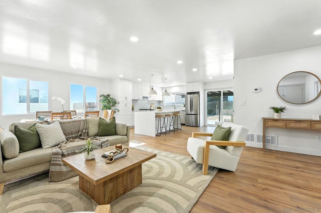 Welcome to this beautifully renovated single-story home in the sought-after Carlton Oaks neighborhood of Santee. From the moment you step inside, you’ll be greeted by a bright, open layout that flows effortlessly from the living and dining areas into a stylish, updated kitchen with sleek finishes. To one side of the home, you’ll find three bedrooms and two full baths, including a spacious primary suite with dual closets and a private en-suite. Throughout the home, thoughtful enhancements create a fresh, modern feel blending comfort with style. The backyard features a covered patio and generous open space, ready for your vision whether its a garden, play area, or outdoor lounge. Additional highlights include a two-car garage and a prime location near Carlton Oaks Elementary, West Hills High, Santee Lakes, Santee Trolley Square, and easy freeway access. Move-in ready and full of charm, this home is perfect for those seeking style, comfort, and convenience in one of Santee’s most desirable communities.