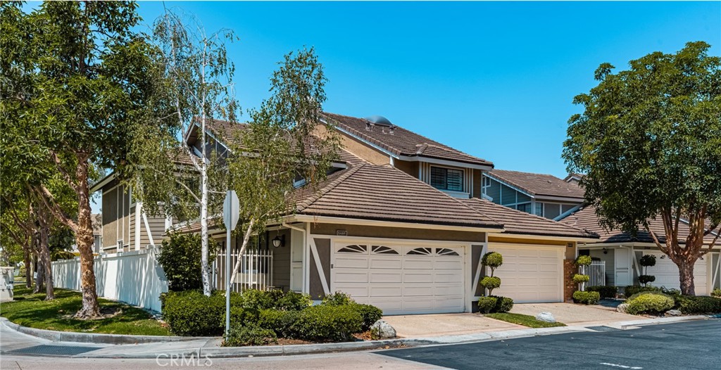Enjoy the best of Yorba Linda’s East Lake Shores Village in this beautiful lake front 3 bed/3 bath home with an attached 2 car garage, private boat dock, and breathtaking lake view. The home features a bright, expanded living room, soaring ceilings, and a corner fireplace, with folding sliding doors opening to a spacious lakeside patio with a spectacular view. The kitchen includes stainless steel appliances, white cabinetry, and a cozy breakfast nook. A downstairs bedroom and full bath offer flexibility for guests or a home office. Upstairs, the primary suite boasts vaulted ceilings, a private deck with lake view, and en-suite bath with dual vanities and an oversized walk-in shower. A second spacious upstairs bedroom with an en-suite bath. Enjoy the vibrant lakeside lifestyle with community amenities including clubhouse, walking trails, state of the art Junior Olympic sized pool, and spa, gym, sport courts including Basketball, Badminton, Pickle ball and Volleyball! The neighborhood comes alive with festive spirit with seasonal celebrations year-round and holiday gatherings that bring the community together. Every day feels like a getaway!!!