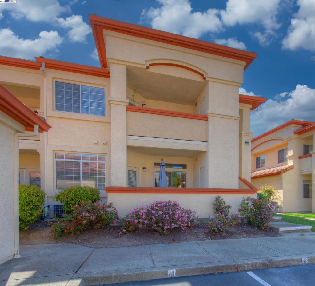 This charming 2 bedroom, 2 bath ground-floor condo is perfect for anyone! One covered parking space AND one detached car garage come with this unit! Seldom on the market for the largest sqft of the 2 bedroom units in this complex. Situated away from the main street noise, this unit is quiet and serene. Features two private patios, in-unit laundry for your convenience, remodeled bathrooms, and all appliances included. Enjoy resort-style amenities: pool, tennis courts, gym, clubhouse, playground, BBQ area, Guest parking and a dog park right across the street from the Alamo Creek Villas. Lots of trails for the outdoor lovers. Prime Dublin location with top-rated schools, easy freeway/BART access, shopping, and dining nearby. Comfort, convenience, and community—your ideal home awaits! Come see it Sunday 8/10 1-3 pm