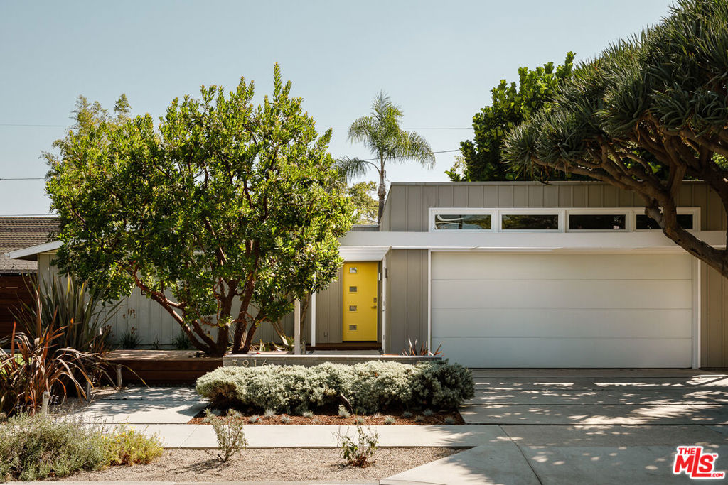 The Drake House | Paul Edward Tay, 1950. One of the architect's earliest designs, it displays the sophistication in planning and detailing that he would soon become known for. Current owners enlisted Interstices Architecture to expand the home and rebuild + reorient the garage. Their plan skillfully kept Tay's original entryway trellis detail as well as a mature Dracaena Draco tree, both of which cast distinctive shadows across the home in the late afternoon. The garage orientation change allowed space for a front yard lawn and garden area entrance. The other major focus of the addition was a multi-use studio/gallery for the artist owners to create and display large scale artwork. A massive three panel glass pocket door with clerestory window above allows for one wall to disappear completely, opening the space to the private rear patio and pool. The skylit entry foyer with interior planting and tiled fountain wall water feature was also created in the recent addition. Just beyond this space is the original home, signified by the Roman brick fireplace and adjacent wall of built-ins. The layout placed the primary and en-suite bath at the street facing, with two guest bedrooms at the rear end of the house. An open plan living room, dining area, and kitchen encompasses the space in between. With playful variances of height and subtle divisions of space, Tay's architecture is ever present. A south facing window wall embraces the patio and pool. A dense row of fiddle leaf fig trees and wall of bamboo provides privacy for the home and outdoor areas. The updates are too numerous to list fully, but include three separate HVAC zones (home, gallery, & garage), roof replacement, paid off solar panels, dual pane glazing + doors, cork flooring, updated appliances + stackable washer/dryer, renovated baths (including jacuzzi tub at primary), full renovation of pool(eco smarte system, pump & heater, hydrazzo finish, cover care retractable cover), spa tub, Ipe wood decking, built-in natural gas fire pit, outdoor shower area, property drainage with dry well at front yard area, Alford designs landscape, drip irrigation, hardscape, lighting, and much more. Garage rebuild included top quality insulation, mini split, adjacent 3/4 bath and its own entrance in case the owners ever opted to convert it into an ADU. A rare opportunity to see a home so thoroughly and carefully updated in this range of price. Well situated on a peaceful street in Bixby Knolls- one of the city's most vibrant and picturesque neighborhoods.