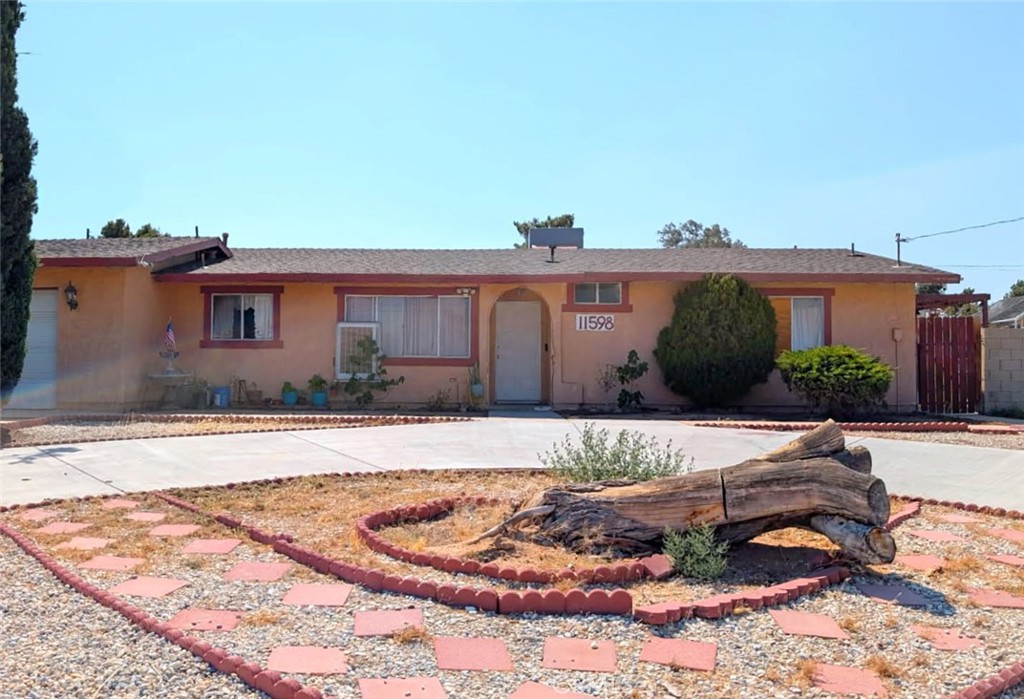 This 3-bedroom, 2-bath home offers 1,363 sq. ft. of living space on a 19,500 sq. ft. lot with an in-ground pool. Recent upgrades include a new water heater, a new dual air conditioning system, and a swamp cooler. Tile flooring throughout and an attached 2-car garage add value. Located near schools, shopping, and local amenities, this property combines a desirable location with a generous lot size.