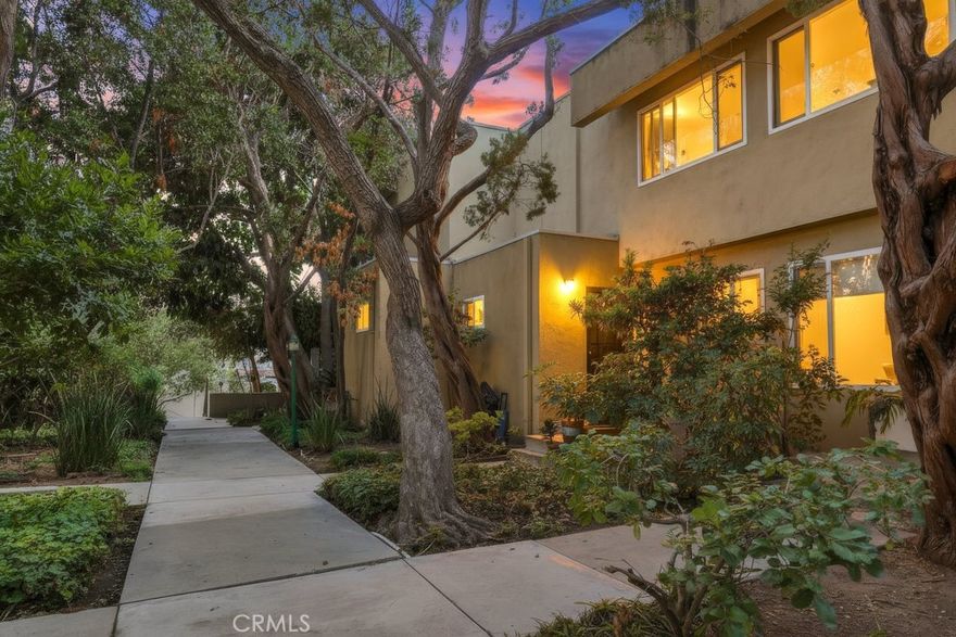 Located in a peaceful, tree-lined community within Studio City, this spacious 2-level condo delivers privacy, value, and exceptional location. Enter on the ground floor to find a large living room, freshly painted wall, updated flooring and kitchen, half bath, and extra storage space under the stairs. Sliding doors off the dining area lead to a private balcony boasting open tree-top views with no buildings behind. Upstairs are two ample bedrooms with new carpeting and a large bathroom that has space to add HOA-approved in-unit laundry. Added perks include Central AC, dedicated carport parking with additional storage, pet-friendly greenbelts throughout the complex, and a sparkling pool area.