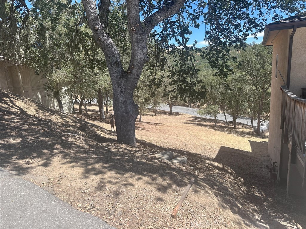 Build your dream lake getaway in the gated community of Oak Shores at Lake Nacimiento! This sloped downhill lot is located near a quiet cul-de-sac, offering minimal through traffic. Oak Shores is a vibrant lakeside community featuring two private launch ramps, a full-service marina with privately owned slips plus over 60 courtesy slips available on first come first served basis, a heated swimming pool, and a spacious 4,800 sq. ft. clubhouse for gatherings and events. Additional amenities include a campground for guests, a dog park, pickleball courts, a miniature golf course, and scenic hiking trails. Enjoy boating, fishing, and year-round recreation in this sought-after Central Coast destination