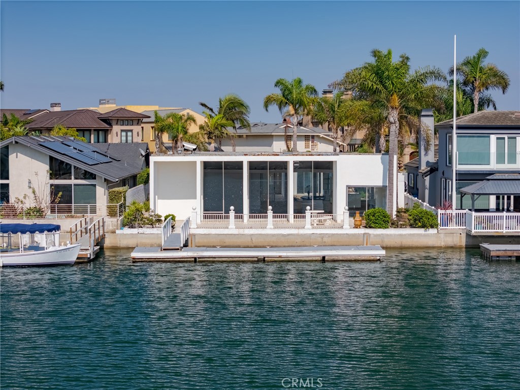 This timeless mid - century modern waterfront home is located in one of Huntington Harbour's most coveted neighborhoods- Gilbert Island. The 3 bed, 3 bath single level property spans over 2,800 square feet on nearly a 7,600 square foot parcel. Additional features include a private courtyard with in-ground spa, deck with harbour views, 2 car garage, and a 45 foot boat dock. Iconic Sunset Beach is walking distance, along with dinning, entertainment, top schools and freeway access.
