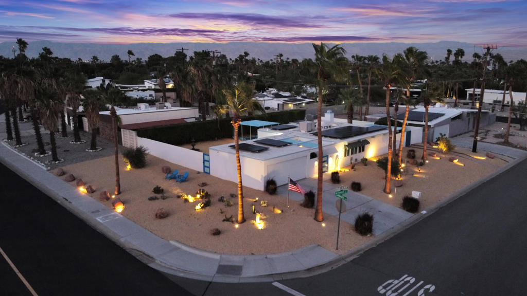 Welcome to 600 E Alexander Way, a quintessential 1959 Mid-Century Modern gem located in the sought-after Racquet Club East neighborhood of Palm Springs. Designed by renowned architects Palmer & Krisel and built by the Alexander Construction Company, this architecturally significant home beautifully blends timeless design with high-end modern upgrades -- making it one of the most updated mid-century homes on the market today. Situated on a corner lot with the most amazing unobstructed mountain views, thoughtfully reimagined with over $175,000 in improvements, the home includes a fully warranted list of updates: new HVAC with air scrubber & surge protection, updated sewer line, windows, desert landscaping with irrigation system, roof, French drain system, mini-split A/C in the primary bedroom, insulation, security camera/alarm system, garage cabinets, epoxy flooring, 27 solar panels, dual security gates, updated pool & equipment, water purification system, and more. And yes -- all warranties are transferable to the new owner. As you step inside, you're immediately greeted by the charm of exposed tongue-and-groove wood ceilings, floor-to-ceiling windows, and an open floor plan designed for effortless indoor/outdoor living. The home features sleek custom cabinetry, a chef's kitchen with a dramatic waterfall island, and remodeled bathrooms with tiled walk-in showers. Step outside to your private desert oasis, complete with a new pool with tanning shelf and Pentair ultra temp electric pump, hot tub, and cantilevered sunscreens that provide shade while complementing the home's original design. All this with unobstructed San Jacinto Mountain views as your backdrop. Whether you're seeking a full-time residence, weekend escape, or high-end vacation rental, this property is ready to impress. No HOA. Fee simple -- you own the land