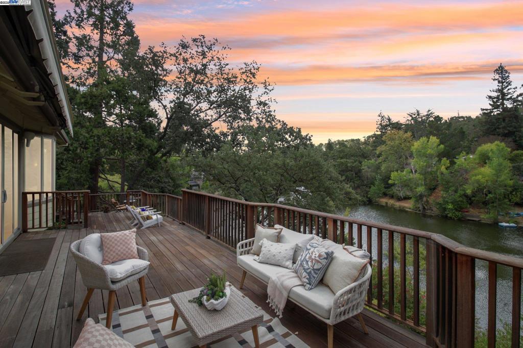 ONE-OF-A-KIND - it truly is! This Lakehouse sits atop the tranquil shores of Walnut Creek’s hidden lake. This rare and cherished 4-bedroom, 3-bath home is being offered for the first time in 50 years. Lovingly maintained by its long-time owners, it is more than a residence—it’s a piece of the lake’s history. One of only 16 homes on the water, it holds the unique distinction of being the only property with private beach access directly from the house, offering unmatched privacy and convenience. Beyond its idyllic setting, the home features inviting sunrooms filled with natural light, a dedicated office for work, a wine cellar perfect for the collector/entertainer, and even an indoor putting green for golf enthusiasts. Modern finishes that includes updated kitchen, EV charger, multiple skylights, in-law suite downstairs, it's designed for both quiet moments and lively gatherings. Imagine morning coffee on the deck, afternoons swimming or kayaking, and evenings spent with friends by the water. Just 1.5 miles from vibrant downtown Walnut Creek, it offers the rare balance of peaceful seclusion, shopping, dining, cultural attractions, and the added benefit of top-rated Walnut Creek schools. Opportunities like this are exceptionally rare—a true lakeside legacy awaiting its next chapter.