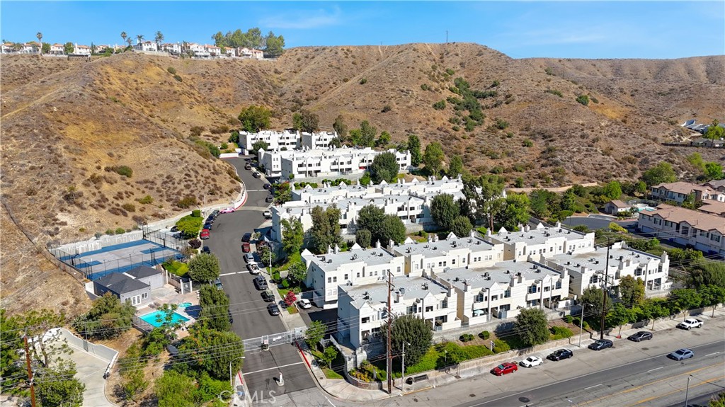 Priced to Sell! Updated 2-bedroom, 2-bath condo offering a smart layout and stylish finishes. The living area features laminate wood flooring, recessed lighting, and a decorative fireplace for a cozy ambiance. A well-appointed kitchen includes granite countertops, stainless steel appliances, and rich wood cabinetry.
Step outside to a private balcony with peaceful mountain views, perfect for relaxing or enjoying your morning coffee. The primary suite features a walk-through closet and ensuite with a walk-in shower. The secondary bedroom offers flexibility for guests or a home office. In-unit laundry adds everyday convenience.
This home also includes a 2-car tandem shared garage and two private storage rooms (approx. 5'x6' each). Residents enjoy a community swimming pool, basketball court, and clubhouse. HOA covers water, trash, and common area maintenance. No special assessments. Conveniently located near shopping, dining, and freeway access.