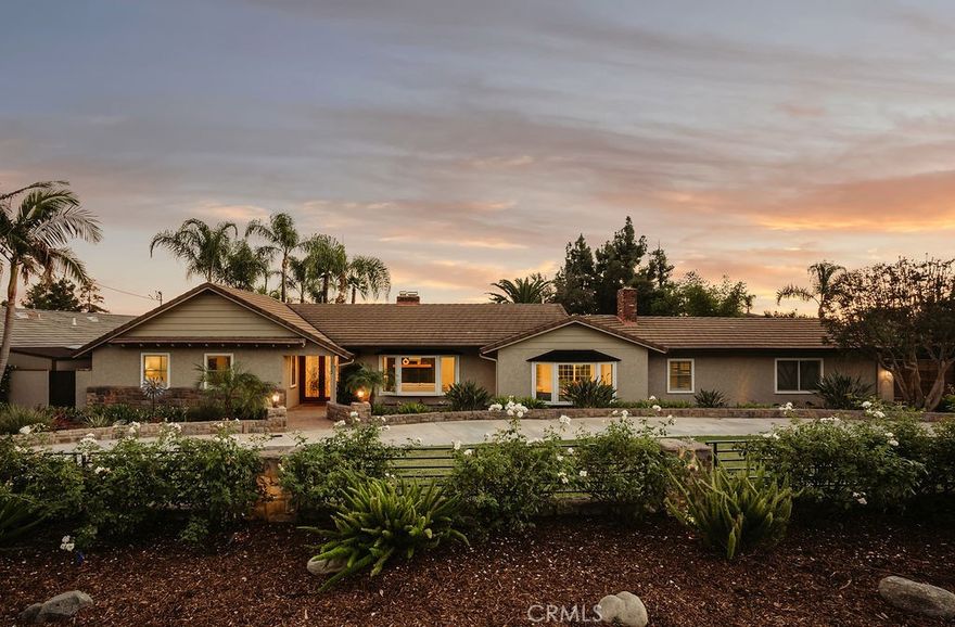 Imagine waking up in North Glendora, where the morning light sneaks through the Anderson windows just right, the coffee tastes better for reasons science can’t explain, and your biggest problem is deciding which fruit tree to pick from first. Lemons? Oranges? Limes? It’s your own personal produce section — without the judgmental self-checkout line.

The home itself nails that effortless California vibe. Real hardwood floors, copper plumbing that won’t throw tantrums, a newer HVAC system that actually keeps its promises, and a layout that flows smoother than your playlist on a Sunday morning. The garage has been converted into a home gym, which you’ll proudly show guests right before explaining why you haven’t had time to use it lately.

Step outside and the backyard instantly becomes the main character. A sparkling pool glistens like it’s sponsored by Vitamin D, a Tiki Hut lounge offers shade for your “I’ll just sit here for five minutes” moments that somehow last three hours, and the half basketball court is perfect for settling friendly disputes. The mountain views to the north and city lights to the south remind you that life really doesn’t get much better than this.  At the far end of the property sits a fully finished shipping container studio with hardwood floors, AC, built-in closet and a private deck perfect for your home office, craft room or 4th bedroom. Three storage sheds, a 20-amp RV panel, and dual LiftMaster gates round out the list of features that make you feel far more competent than you’ll ever admit. Evenings are pure magic. The air smells like citrus, string lights glow, and the city twinkles below as if auditioning to be your nightlight. Friends gather, laughter echoes off the pool water, and someone inevitably declares, “We should do this every weekend.” You nod & smile. When you do venture out, Glendora Village is just minutes away with its cafes, restaurants, and boutiques — the kind of place where everyone seems to know your name. Add in nearby hiking trails like Big Dalton Canyon, Sandburg field and track, and South Hills Park, and you’ve got the perfect mix of adventure, charm, and post-hike margaritas.

This isn’t just a home — it’s a mood, a moment, and a mild flex all rolled into one. Fruit trees, pool days, mountain mornings, and that quiet satisfaction of knowing you live in one of the best pockets of Glendora. Go ahead, picture yourself here. Then stop imagining — and start unpacking.