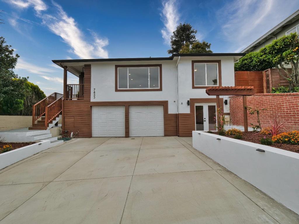 Location, location, location! This beautifully remodeled home is filled with natural light and offers breathtaking views throughout. The main house features 3 bedrooms and 2 full bathrooms, while the fully permitted ADU includes 1 bedroom, 1 full bathroom, air conditioning, and a private no-step entrance, perfect for potential rental income or multigenerational living. Enjoy a brand-new kitchen with custom cabinets and quartz countertops, newly renovated bathrooms, a new roof, and all new appliances. With two upgraded electrical panels, an open and inviting floor plan, and a 2-car garage, this home combines modern comfort with practicality. The ample, low-maintenance backyard features a relaxing hot tub, creating the perfect space for entertaining or unwinding at the end of the day.