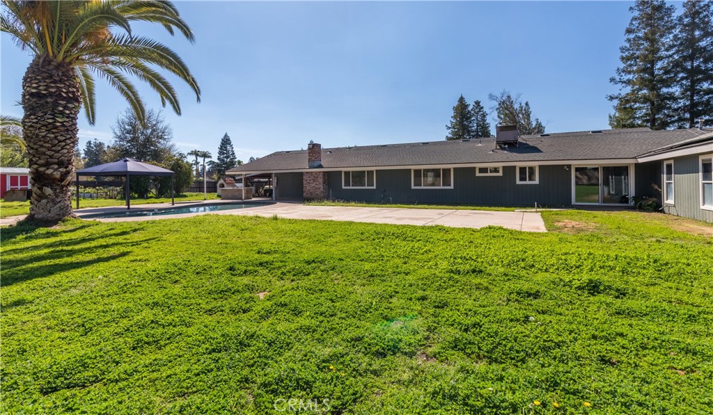 Stunning Fully Remodeled Ranch Home in the quiet Rolling Hills community of Madera! Step into modern luxury with this single-story ranch home featuring 6 spacious bedrooms and 3 full bathrooms. Designed for comfort and style, this home boasts two inviting living areas, a formal dining space, and a chef's dream kitchen with dual islands, pop-up charging stations, and a built-in wine fridge. Indulge in the spectacular laundry room, while illuminated vanity mirrors add a touch of elegance to the bathrooms. Every inch of this home has been thoughtfully updated for 2025 living! Sustainability meets savings with two solar systems:one fully owned and one in a PPA resulting in a $0 yearly True-Up bill. Step outside to your backyard oasis complete with a pristine pool and spa, built-in BBQ, and a wood-fired pizza ovenperfect for entertaining! The garden is ready for a green thumb to bring it back to life. Don't miss this rare opportunity to own a home that blends modern convenience, energy efficiency, and resort-style living.