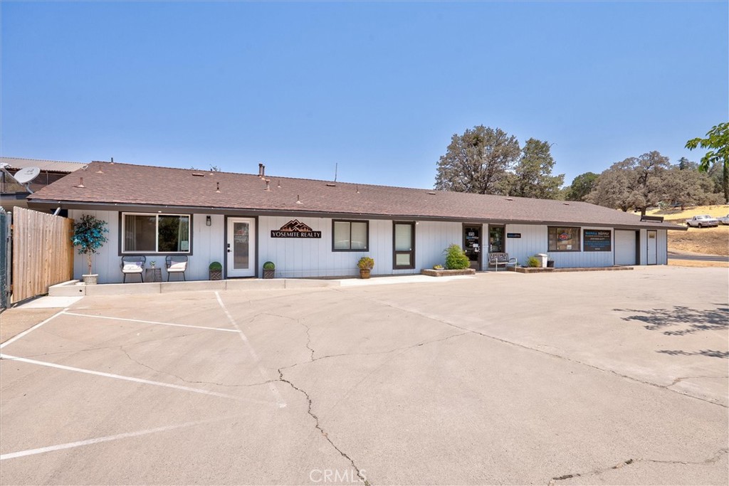 Rare Commercial Opportunity in Mariposa TPA
Don’t miss this chance to own a versatile 4,000 sq ft commercial building on half an acre with prime Highway 49 frontage, located within the Mariposa Town Planning Area (TPA). Not far from the entrance to Yosemite National Park, this property is currently leased to two businesses, one of which recently renovated the back office space with new flooring, paint and more. Leases can be ended upon sale, giving the new owner full flexibility.
The building features a spacious open floor plan plus private office space, its own dedicated parking lot, a rare find in Mariposa, and a fully fenced yard area perfect for material storage or outdoor expansion. Envision transforming it into a bustling restaurant, bar, boutique, or community gathering space with outdoor seating to take advantage of Mariposa’s welcoming atmosphere.
Located near the developing Mariposa Creek Parkway and included in Mariposa County’s future development plan, this property offers excellent current use and exciting long-term potential.
So many possibilities, come make your dream come true in the heart of Mariposa!