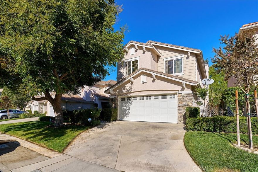 Welcome home to this stunning 3 bedrooms and 2.5 baths home w/Great curb appeal in Stevenson Ranch. Upon entering, you are greeted by a soaring high ceilings, creating an inviting and spacious ambiance. The home features a well-designed layout including a family room, a living room and a dining room, all seamlessly flowing together for easy living and entertaining. The chef's kitchen features a modern white shaker style cabinetry, quartz countertops, stainless steel appliances and a center island that opens beautifully to the family room. Upstairs, you will find 3 bedrooms and a loft, which can be used as a 4th bed. The Primary suite offers vaulted ceiling and a luxurious en-suite bath with double vanity, free standing tub and a separate shower. The spacious backyard with a covered patio is a perfect for entertaining. Located in a desirable neighborhood with top-rated schools, nearby parks, shopping, dining and quick freeway access.