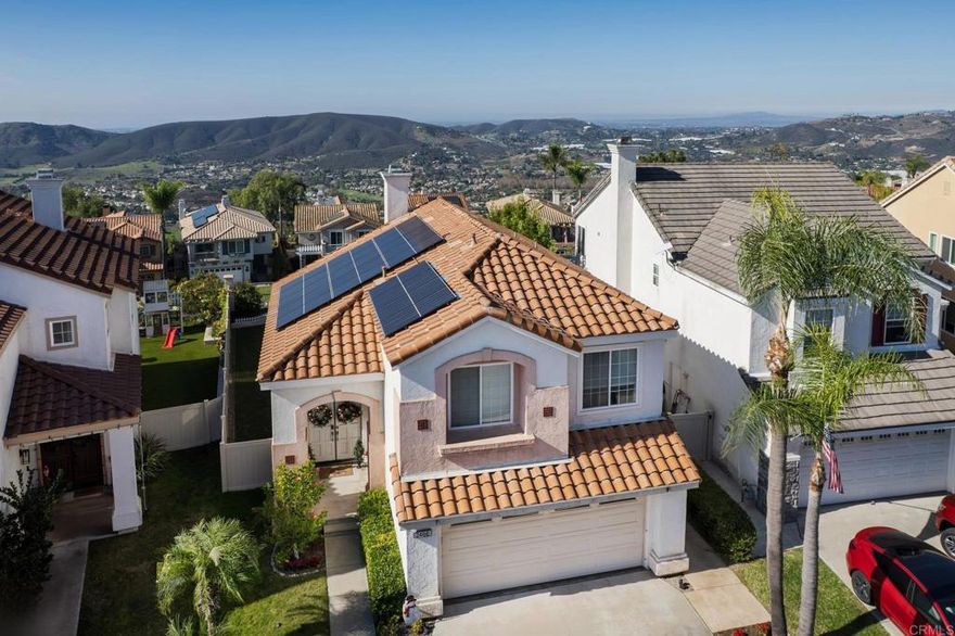 Welcome to The Good Life at the Top of Emerald Heights This beautifully updated 1,620 sf, 3-bedroom, 2.5-bath home sits high on the hill with panoramic ocean, mountain, valley, and city-light views—including Catalina Island on clear days. The sunsets here are absolutely stunning and create an incredible backdrop for everyday living. Step outside to a backyard designed for relaxation and entertainment. A new A-frame patio cover with inset lighting, an outdoor ceiling fan, and a mounted TV creates an inviting year-round gathering space. The yard includes a fresh Bermuda lawn with an edged perimeter, flowering planters, fruit trees, an app-controlled irrigation system, newer vinyl fencing, view fence and a concrete side walkway—perfectly positioned to capture sweeping views from nearly every angle. The home also offers outstanding energy efficiency with an owned 10kW solar system on NEM 2.0. Award winning San Marcos schools.  Inside, the home features a fresh, modern remodel that includes quartz countertops, newer stainless steel appliances and microwave. The kitchen also offers added cabinetry for excellent storage. Upgraded luxury vinyl plank flooring throughout, new carpet on stairs.  Partial new interior paint. The interior has been enhanced with new solid-core shaker style interior doors and upgraded closet doors in the primary bedroom, along with a built-in closet organization system featuring drawers and shelving.The primary bathroom has been tastefully updated with premium shower doors, a new shower, dual sink vanity, mirrors, toilet, and flooring. Both secondary bathrooms have also been fully renovated with new flooring, vanities, and toilets. Additional upgrades include new child-safe window treatments, TP-Link Kasa smart switches throughout the home, a Wyze video doorbell, and a Nest thermostat for efficient smart-home functionality. The whole-house water filtration system provides high-quality water throughout, and the roof underlayment was replaced in 2022. The laundry area accommodates either gas or electric (220V) dryers. Resort-Style Living in Emerald Heights Emerald Heights is a guard gated community offering resort-level amenities, including a heated pool, toddler pool, and spa; a full gym and fitness center; pickleball, basketball, and tennis courts (all lit for nighttime use); a playground; multiple greenbelt parks; scenic hiking trails with viewpoint benches; a rentable clubhouse/event space; a staffed guardhouse; and frequent community events. Homes with this combination of expansive views, modern upgrades, smart-home enhancements, and premier community amenities are rare. Experience elevated living at its finest in Emerald Heights. Don’t miss out on this dialed in, cared for home in one of the best locations in the community.