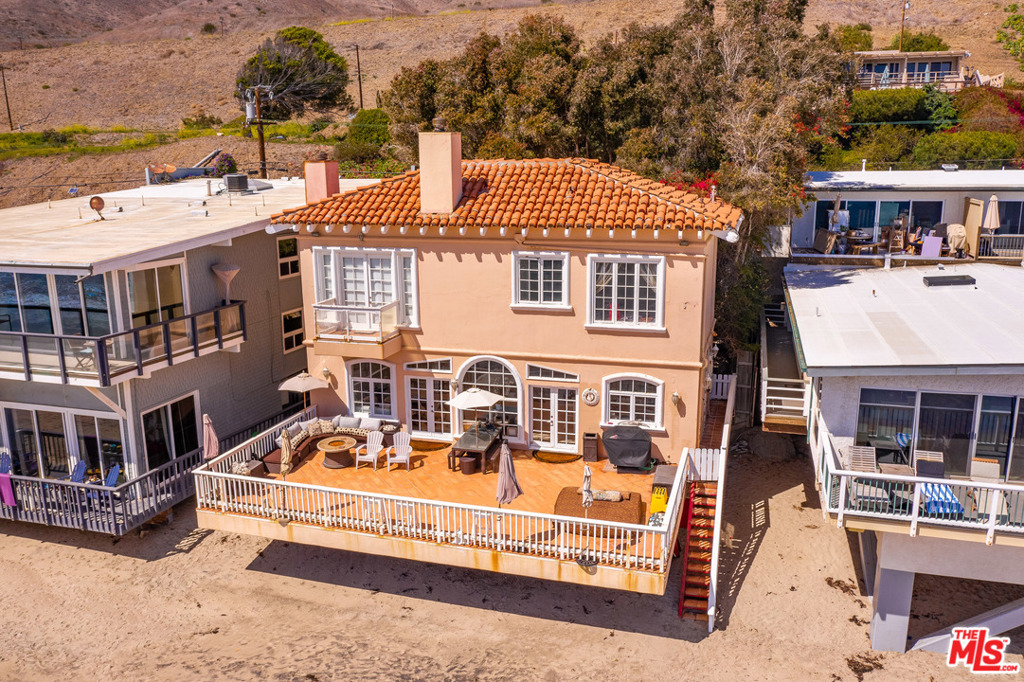 Active and Available. Weekday showings from 10 to 3 with 48 hour notice. Wide sandy beach, wide waterfront deck, wide front parking off street behind the wide ticket line! Tuscan style two story with open concept. French doors from living and dining area to outdoor ocean front play deck. Living room and primary suite have fireplaces. Downstairs den with built in shelving and seating. High ceilings. Upstairs are 3 bedrooms. Primary en suite also has ocean facing balcony. Lush landscaping in deep private courtyard. 2 car detached garage. Long time tenant currently in place, month to month lease. Please do not disturb occupant